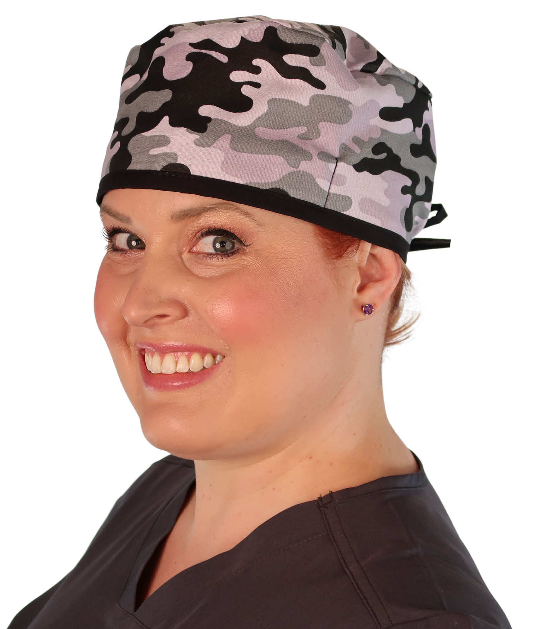 Front Facing View of a Woman Wearing a Classic Cotton Surgical Scrub Cap - Kickin Camo Black and Grey with Black Ties Pattern.