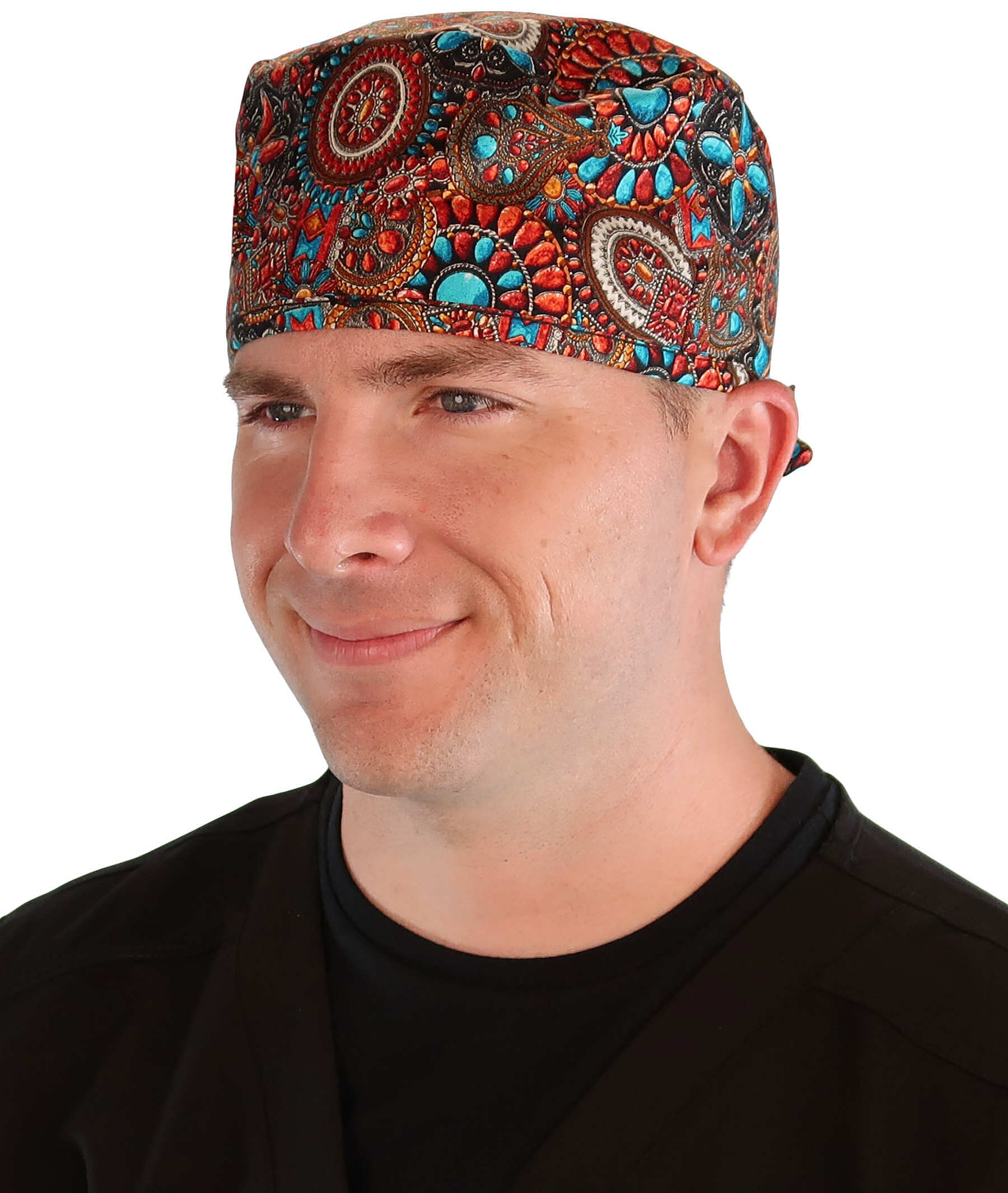 Front facing image of a man in scrubs wearing a Classic Surgical Scrub Cap in Indian Jewelry Coral pattern.