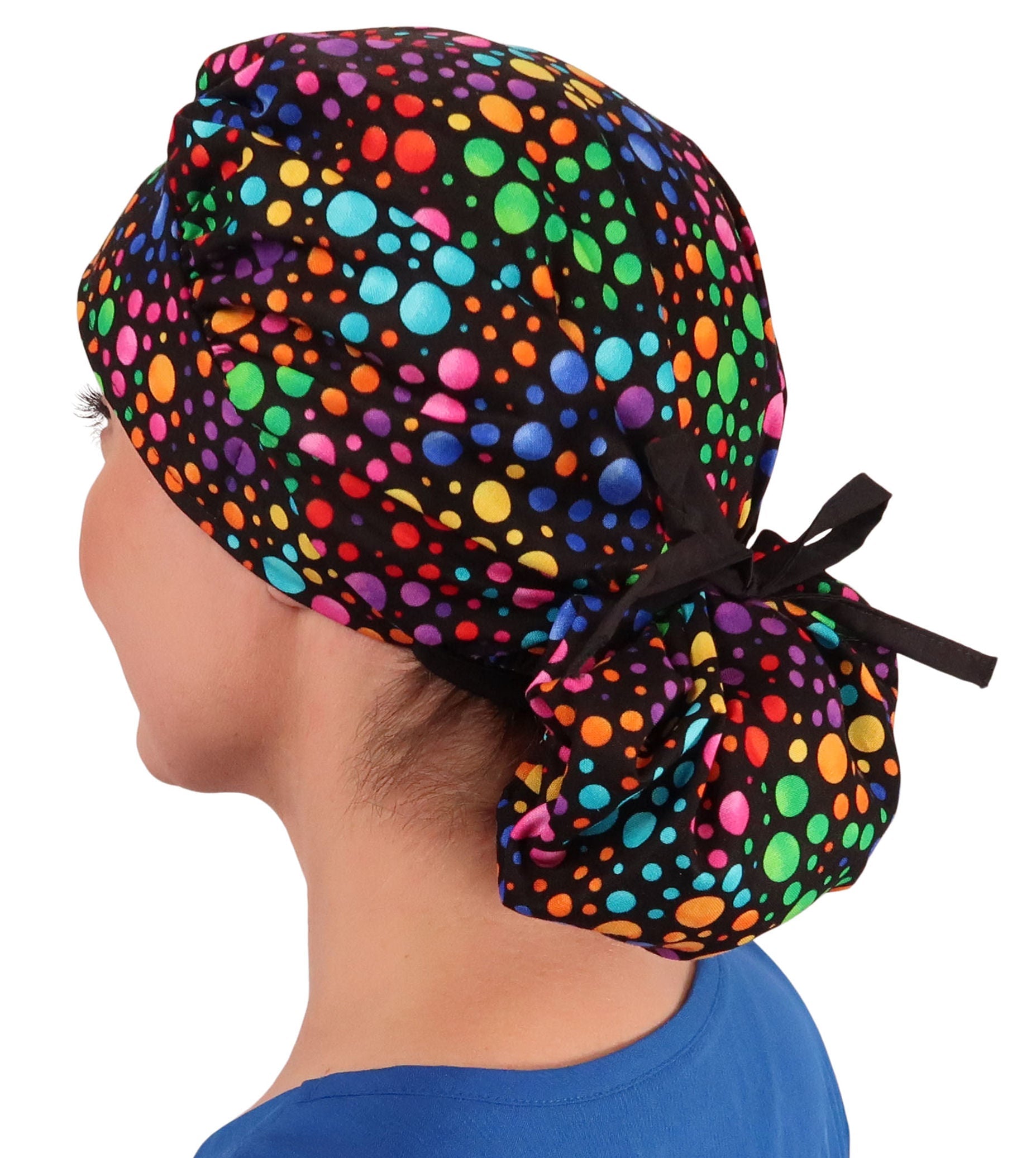 Side Facing Tied View of a Woman Wearing a Tied Back Banded Bouffant Ponytail Surgical Scrub Cap - Multi Color Dots Patterned Fabric with Black Ties 