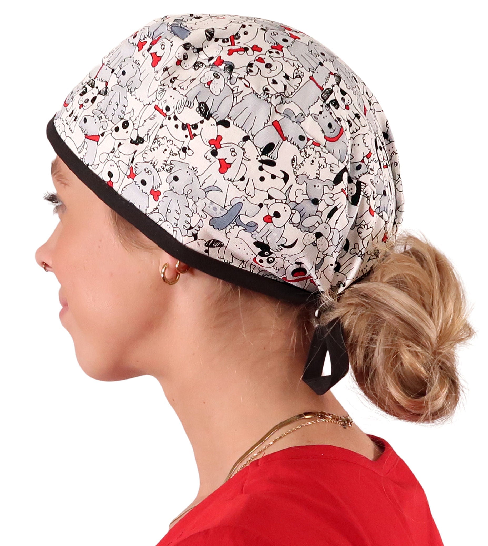 Side Facing View of a Woman Wearing a Classic Cotton Surgical Scrub Cap - Playful Puppies (Dogs) with Black Ties Pattern.