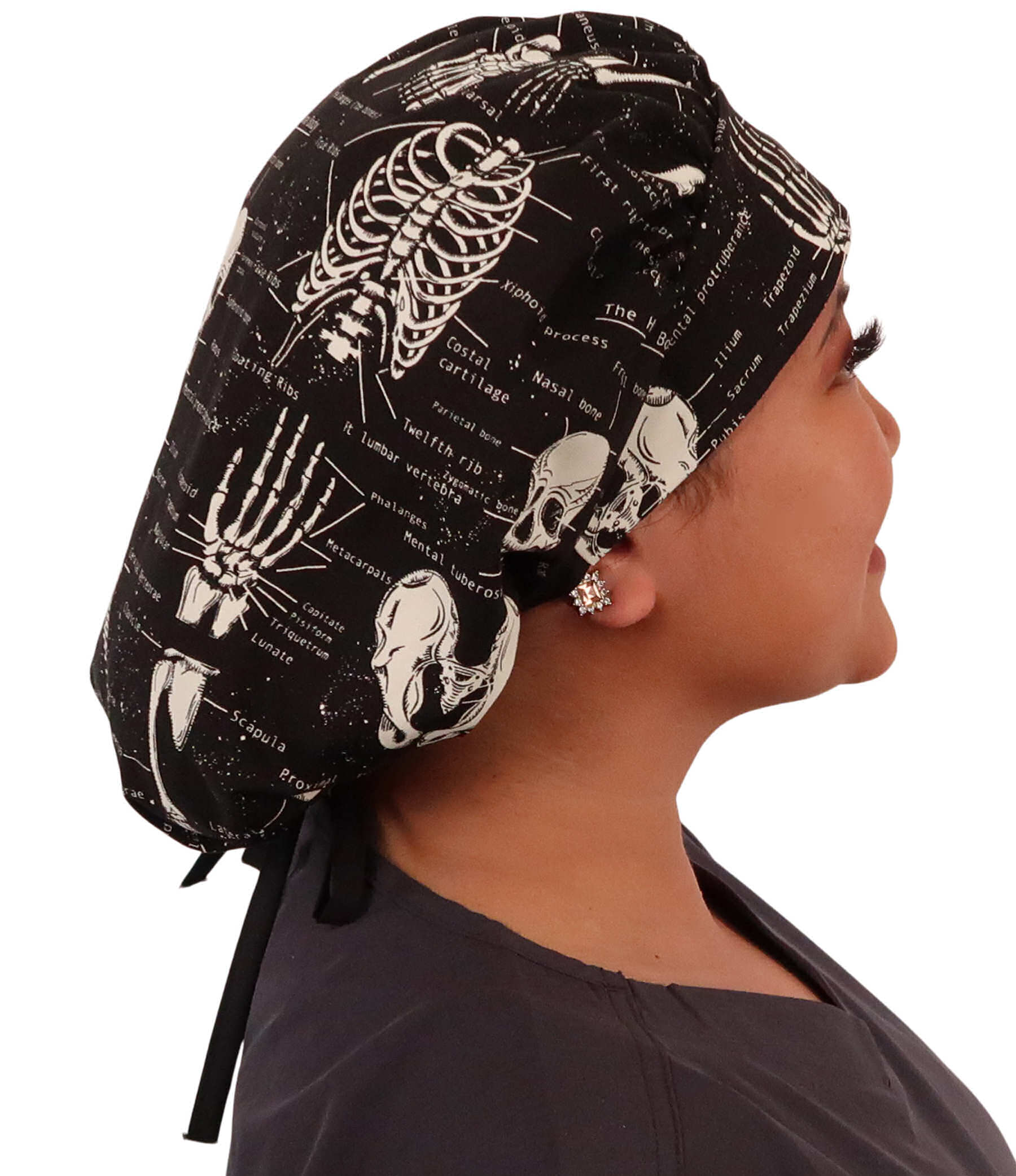 Side Facing Untied View of a Woman Wearing a Banded Bouffant Ponytail Surgical Scrub Cap - Human Body Skeletons Patterned Fabric with Black Ties