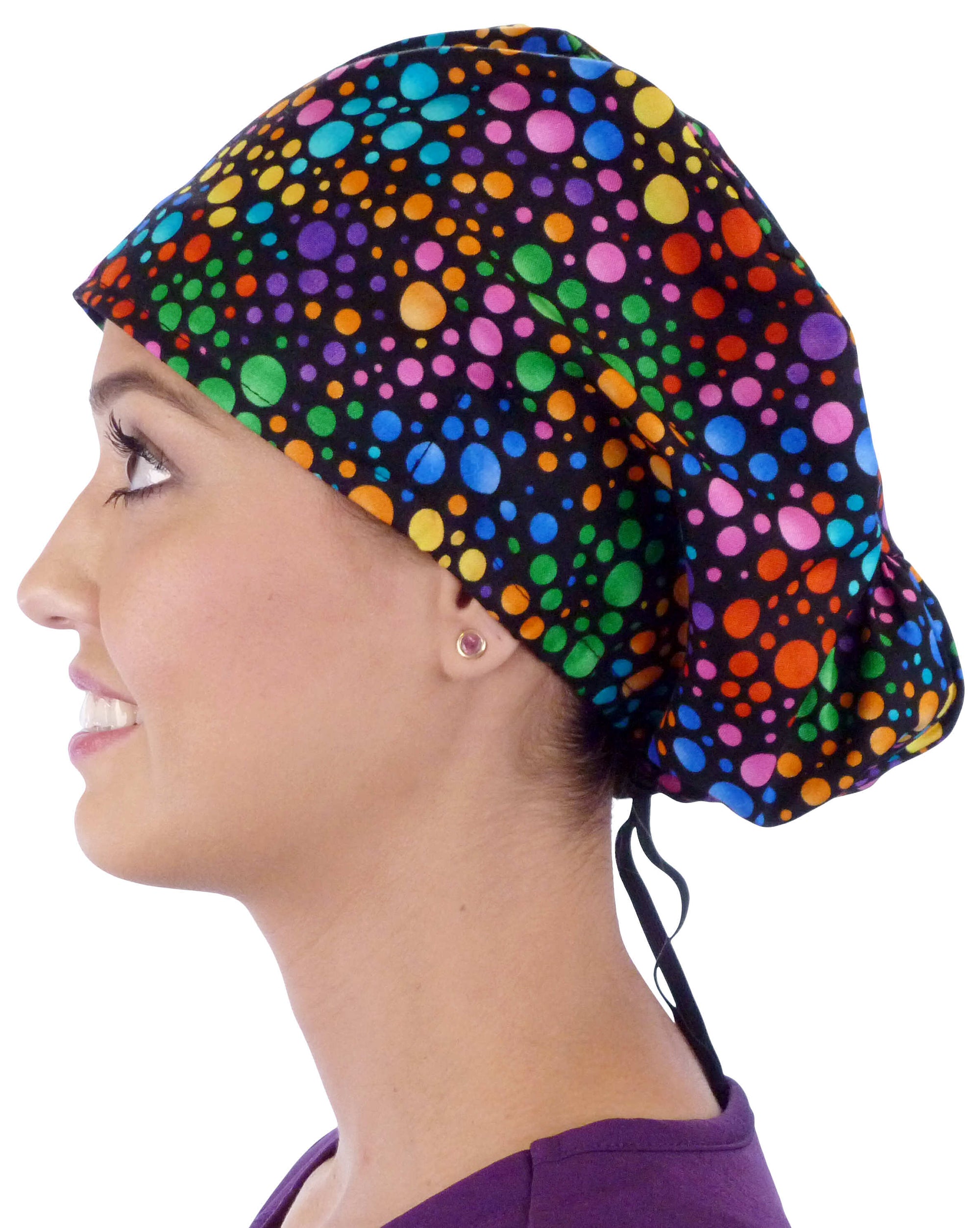 Side facing image of a woman in scrubs wearing a Multi Colored Dots Euro Style Riley Comfort Scrub Cap.