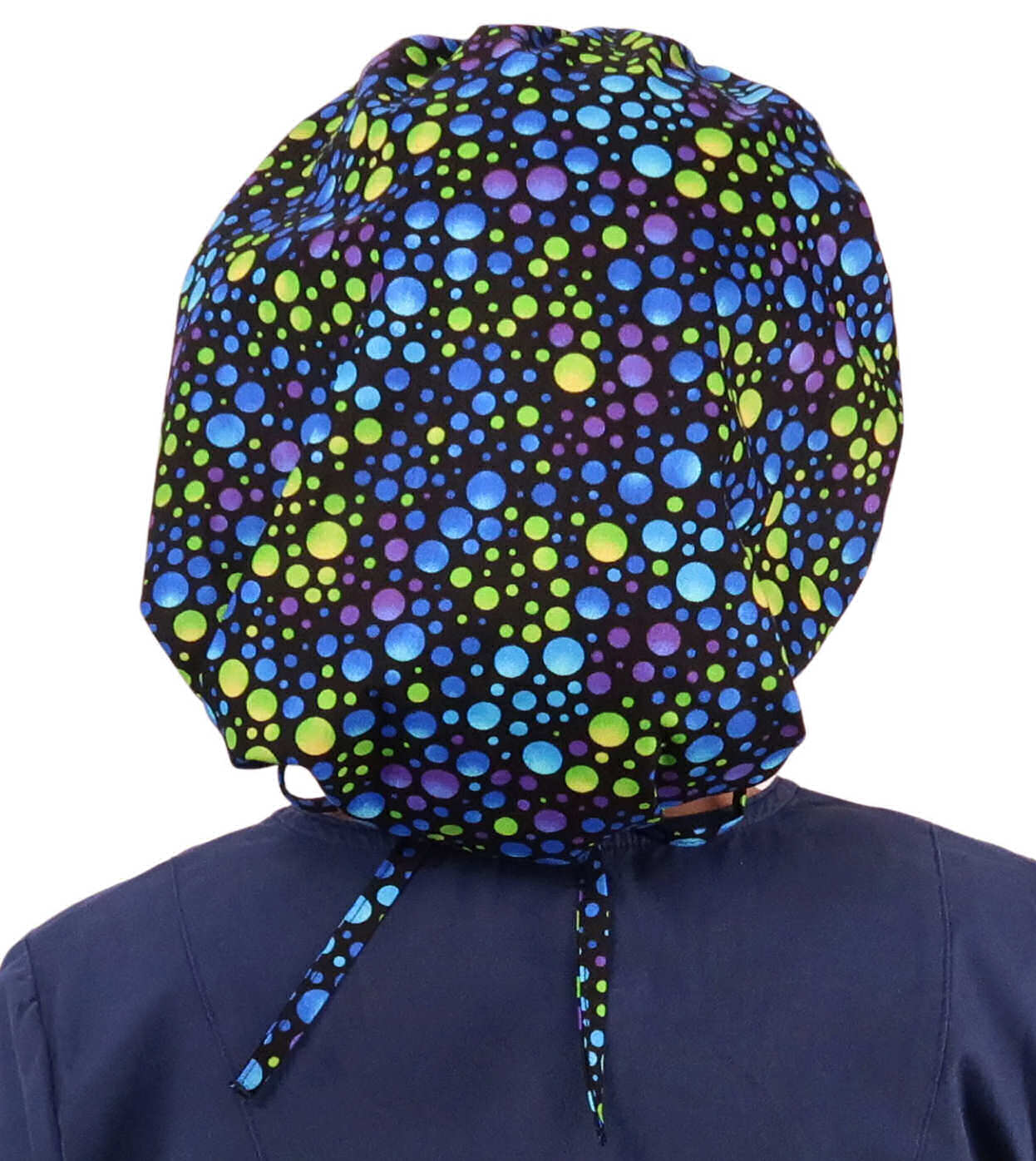 Back Facing Untied View of a Woman Wearing a Tied Back Banded Bouffant Ponytail Surgical Scrub Cap - Blue, Green and Purple Dots Patterned Fabric  