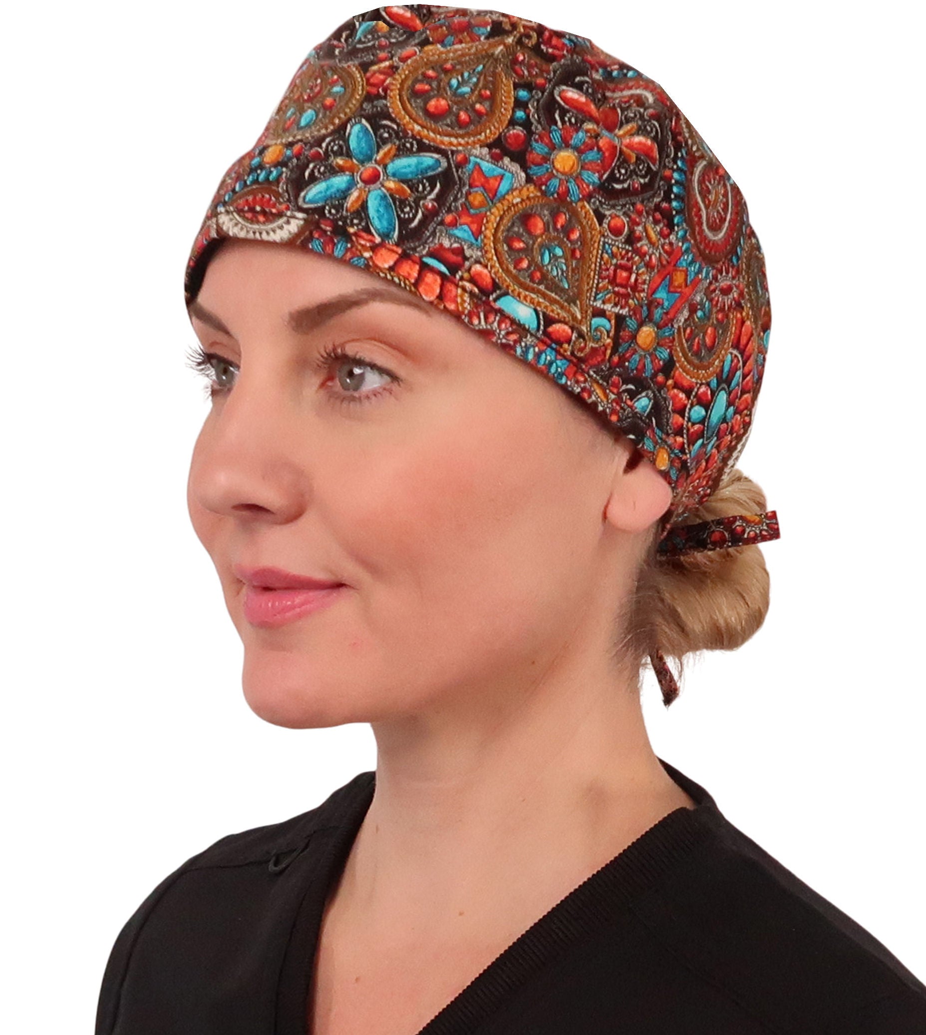 Front facing image of a woman in scrubs wearing a Classic Surgical Scrub Cap in Indian Jewelry Coral pattern.
