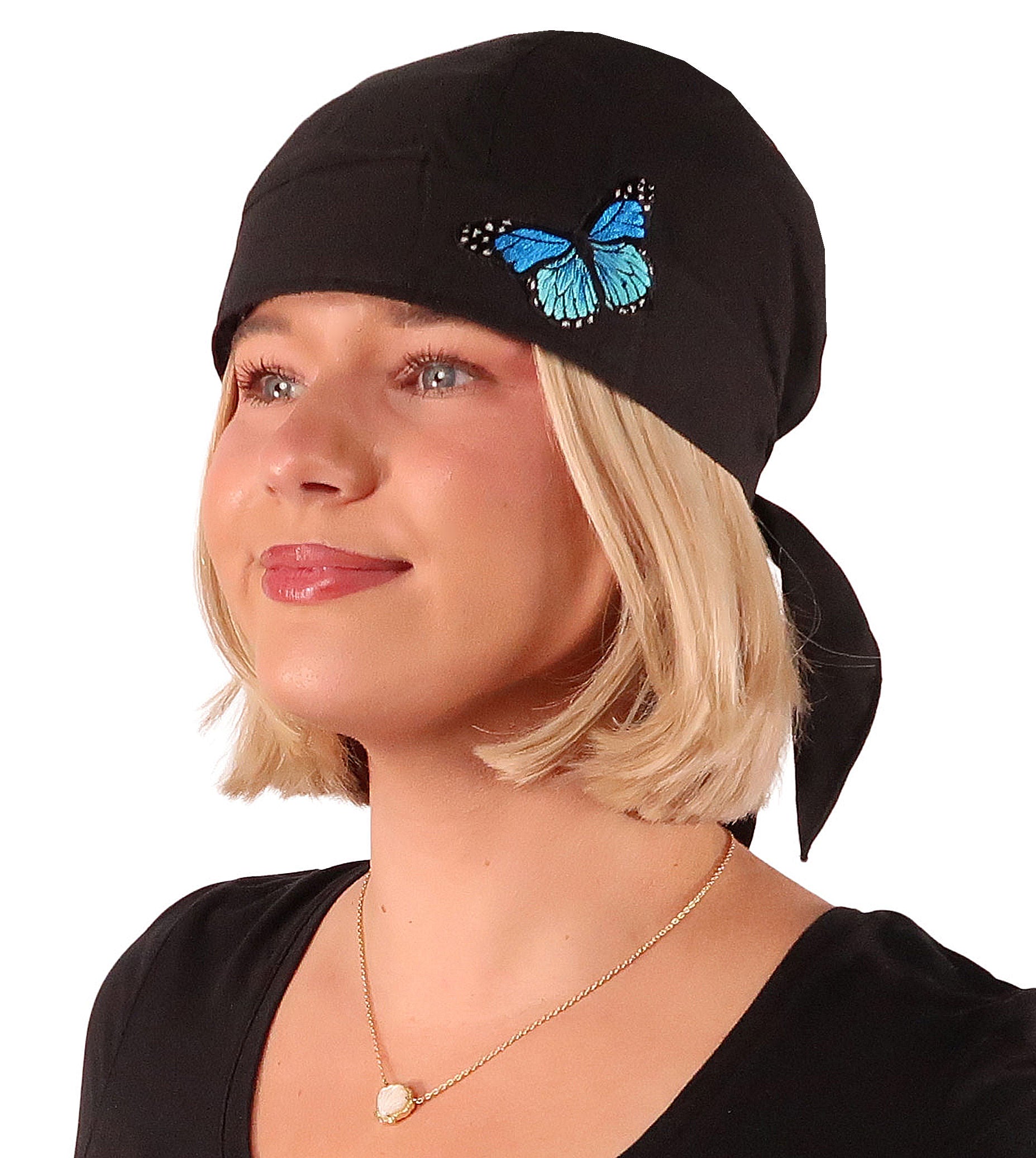 Front Facing View of a woman wearing a classic Skull Cap with a Blue Butterfly Patch on Black. 