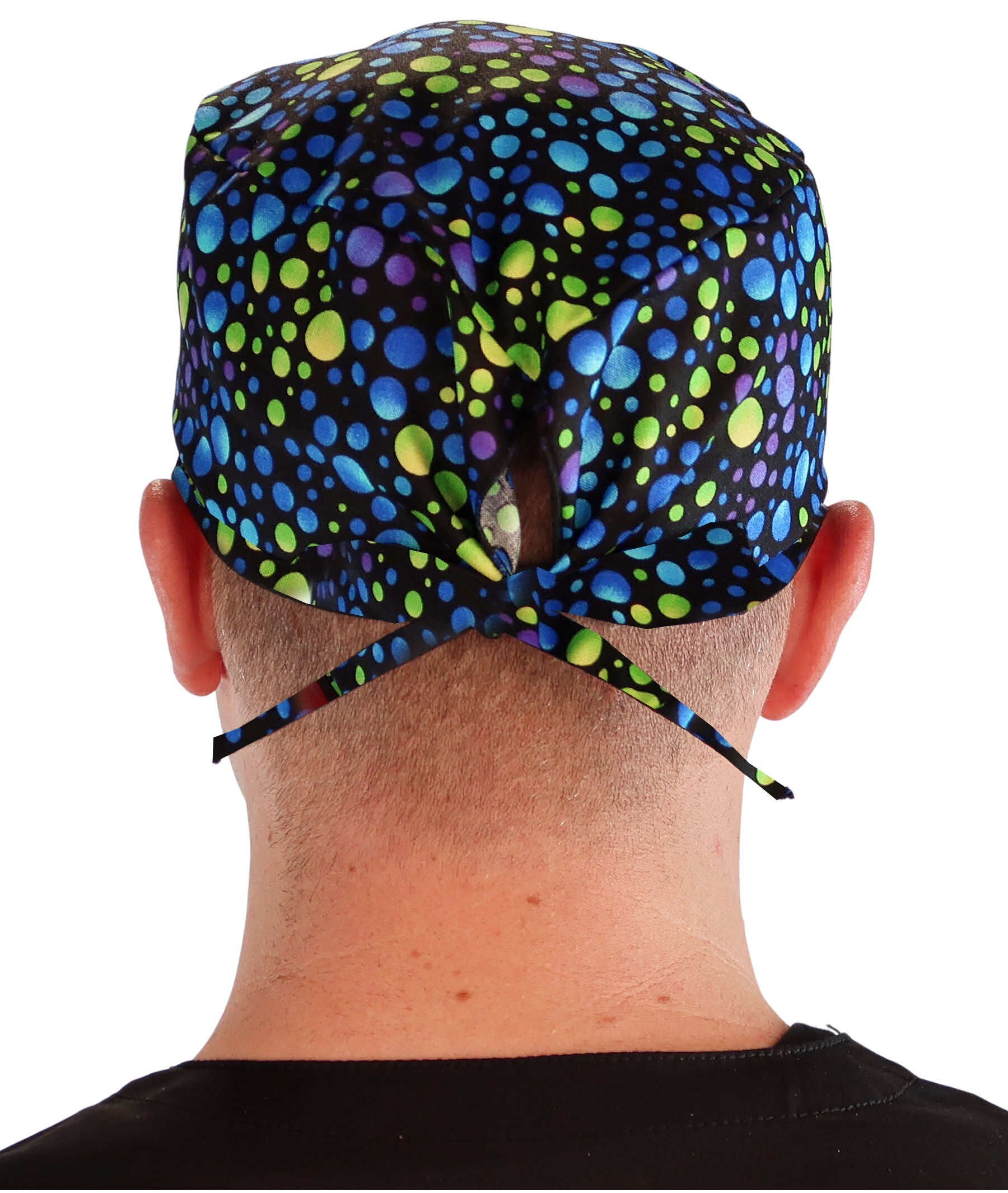 Back facing image of a man in scrubs wearing a Classic Surgical Scrub Cap in a Blue, Green and Purple Dots pattern.