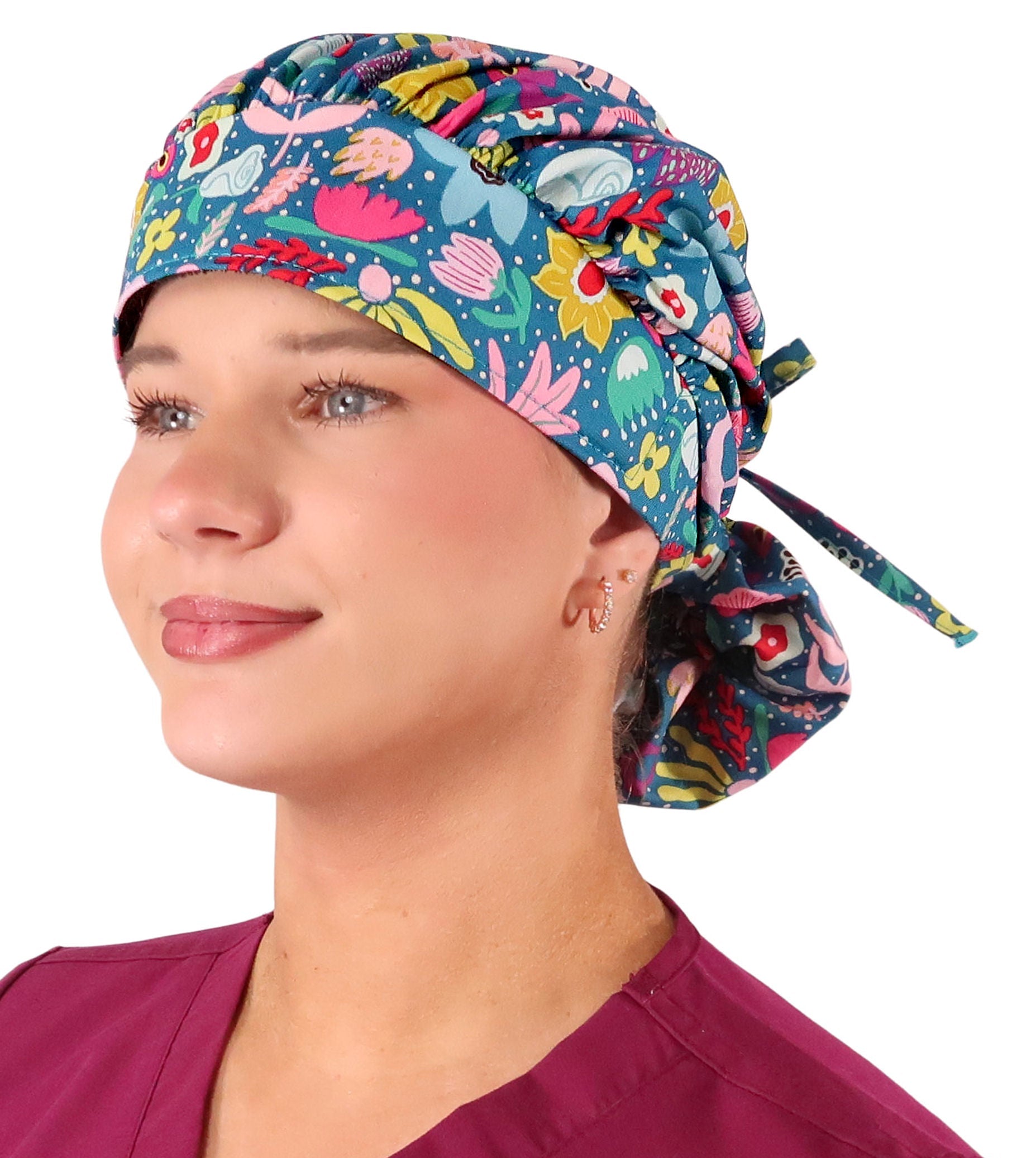 Front Facing View of a Woman Wearing a Bouffant Ponytail Scrub Cap - Floating Flowers Banded Bouffant Ponytail Surgical Scrub Caps Pattern