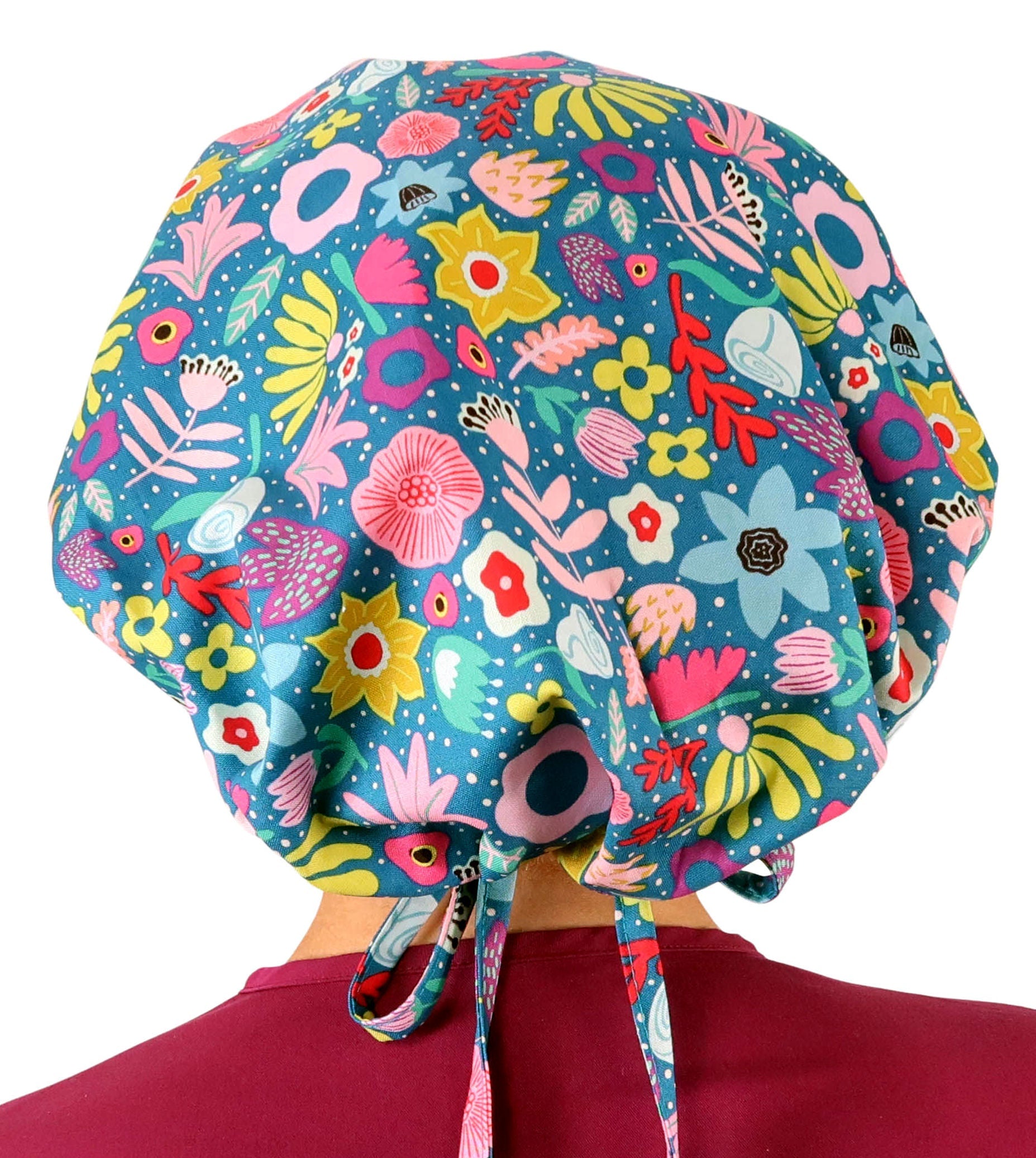 Rear Facing View of a Woman Wearing a Bouffant Ponytail Scrub Cap Not Tied - Floating Flowers Banded Bouffant Ponytail Surgical Scrub Caps Pattern 