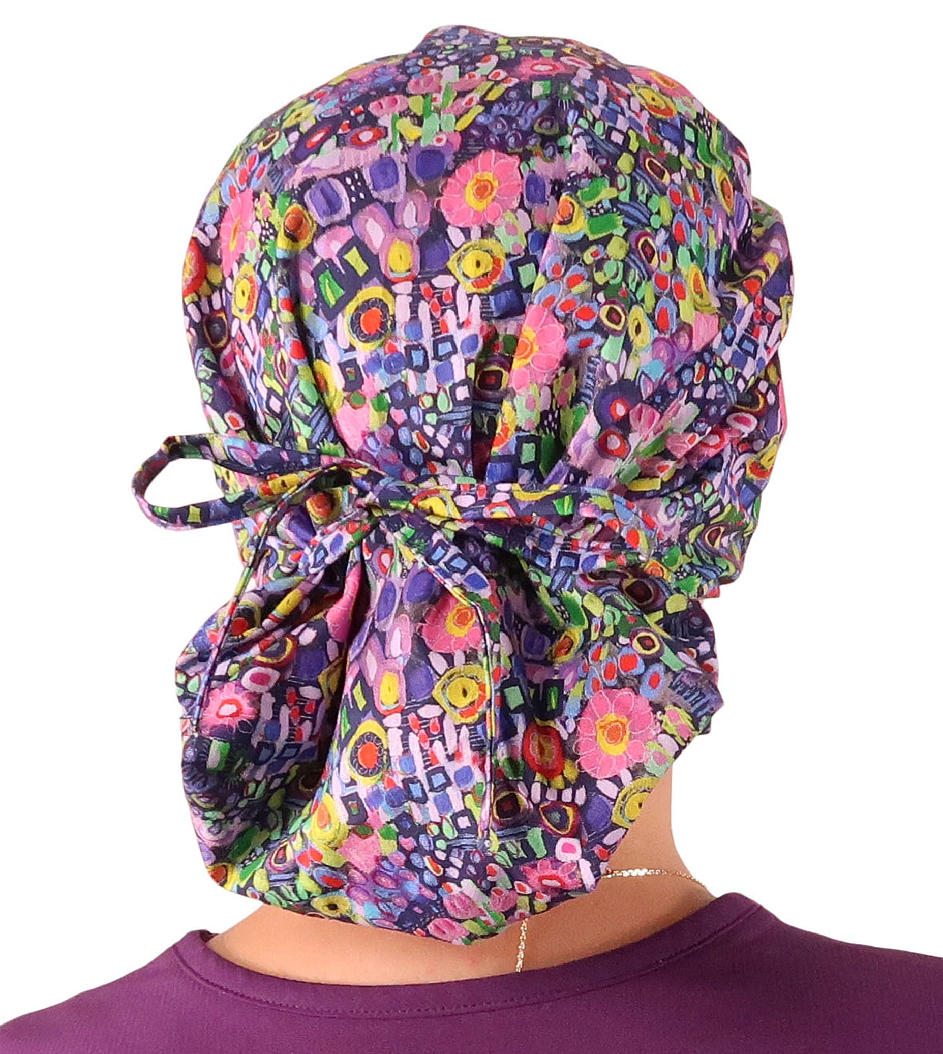 Back Facing Tied View of a Woman Wearing a Bouffant Ponytail Scrub Cap - Painted Petals Banded Bouffant Ponytail Surgical Scrub Caps Pattern