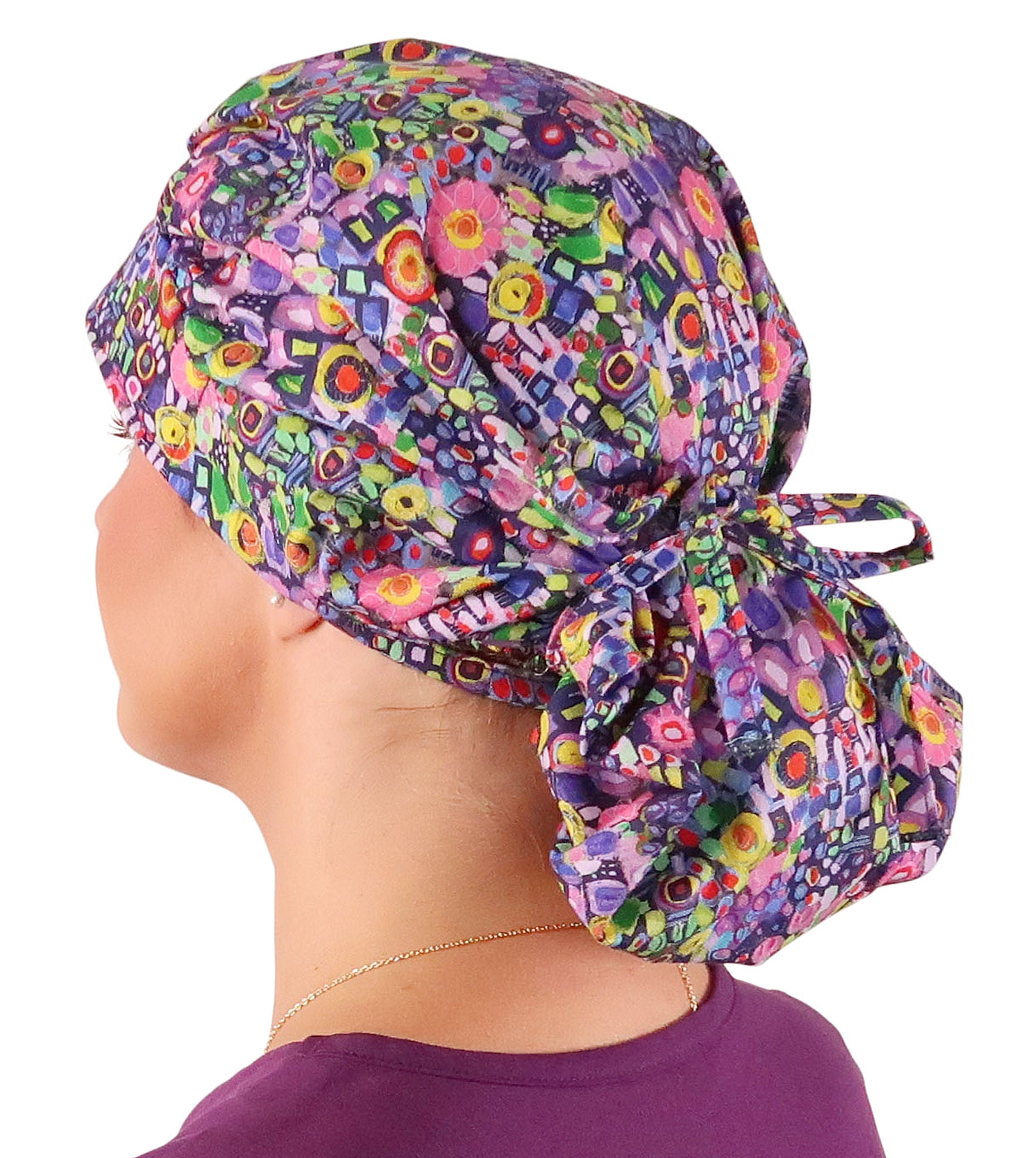 Side Facing Tied View of a Woman Wearing a Bouffant Ponytail Scrub Cap - Painted Petals Banded Bouffant Ponytail Surgical Scrub Caps Pattern