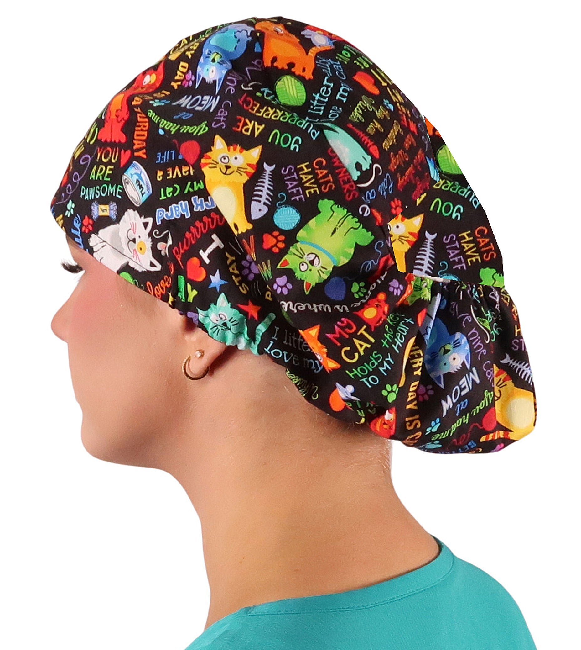 Side facing image of a woman in scrubs wearing a PURRfect Kitties Euro Style Riley Comfort Scrub Cap.