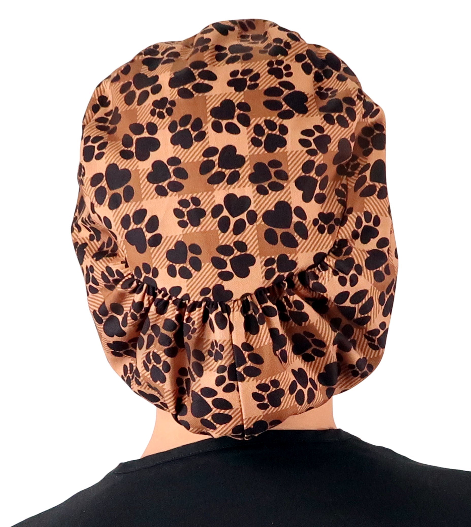 Back facing image of a woman in scrubs wearing a Plentiful Paws on Brown Plaid Euro Style Riley Comfort Scrub Cap.