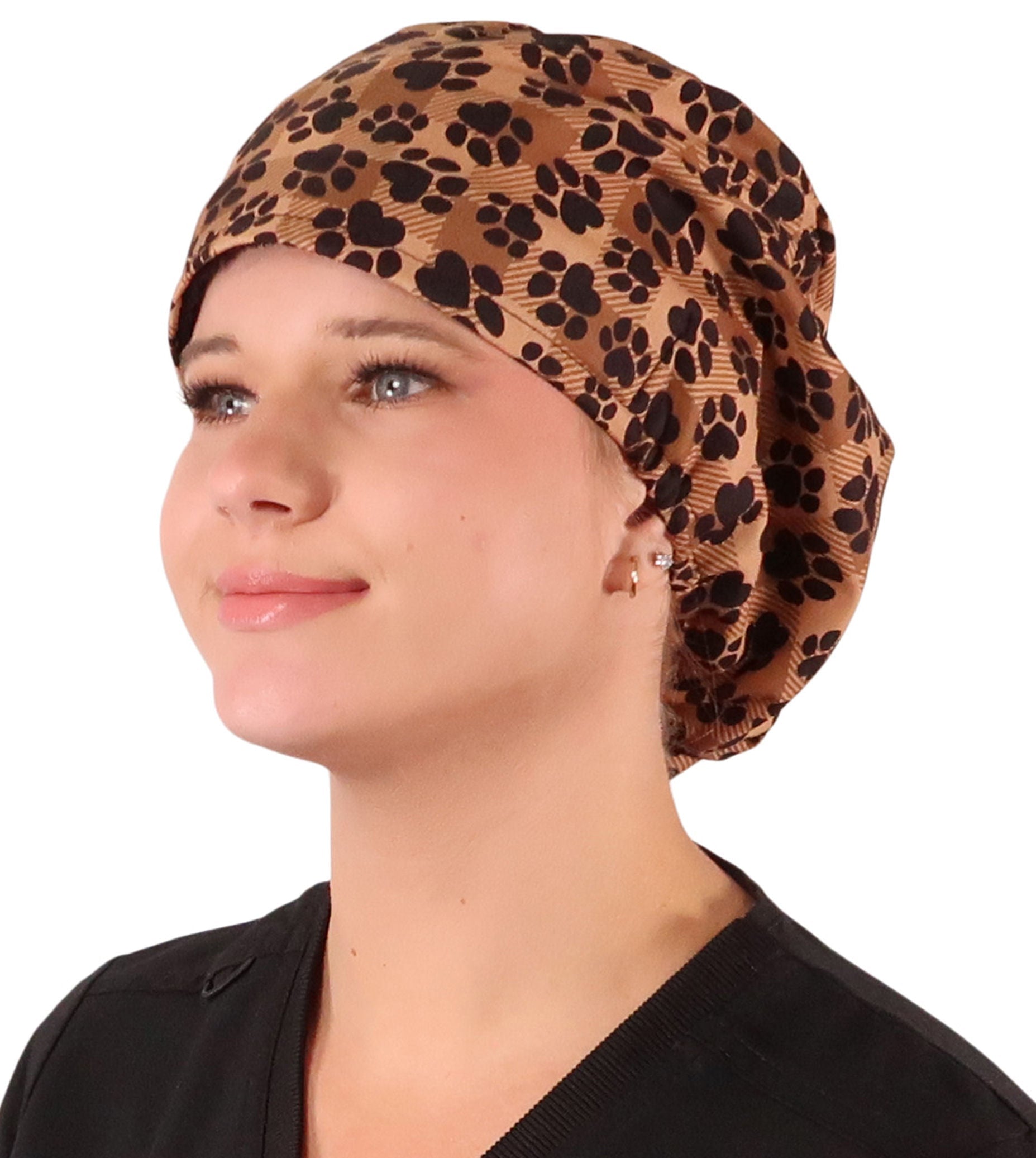 Front facing image of a woman in scrubs wearing a Plentiful Paws on Brown Plaid Euro Style Riley Comfort Scrub Cap.