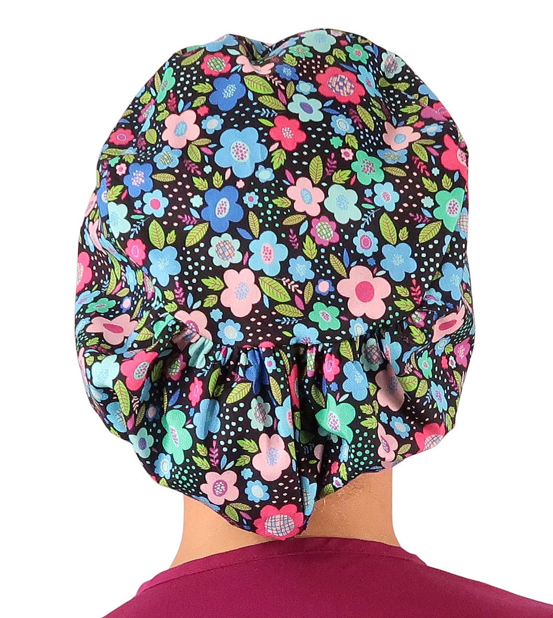 Back facing image of a woman in scrubs wearing a Precious Posies Euro Style Riley Comfort Scrub Cap.