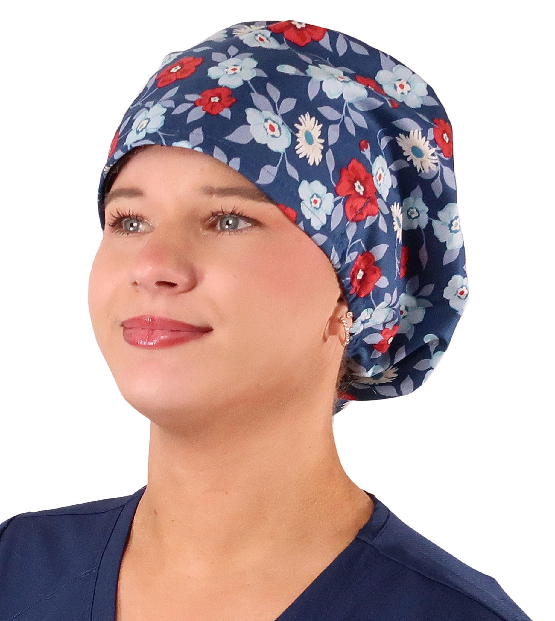 Front facing image of a woman in scrubs wearing a Festive Flowers Euro Style Riley Comfort Scrub Cap.