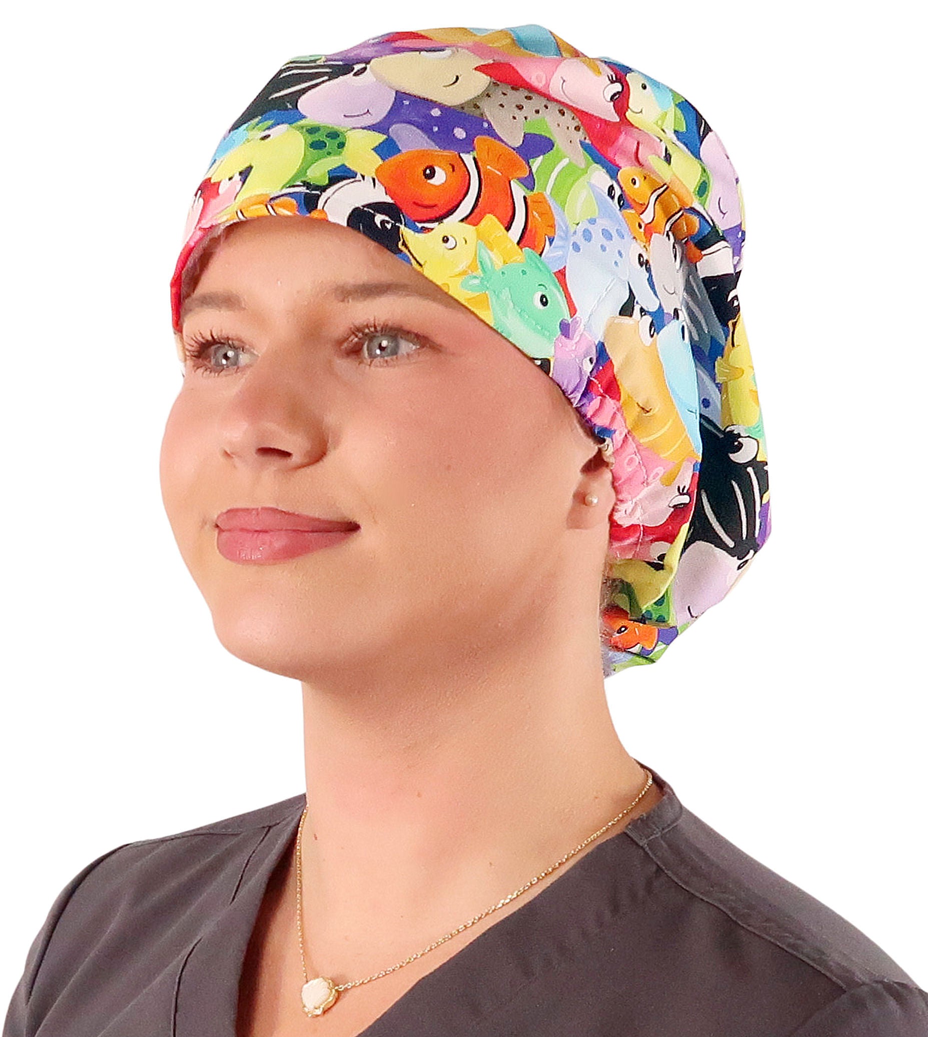 Front facing image of a woman in scrubs wearing a Under The Sea Euro Style Riley Comfort Scrub Cap.
