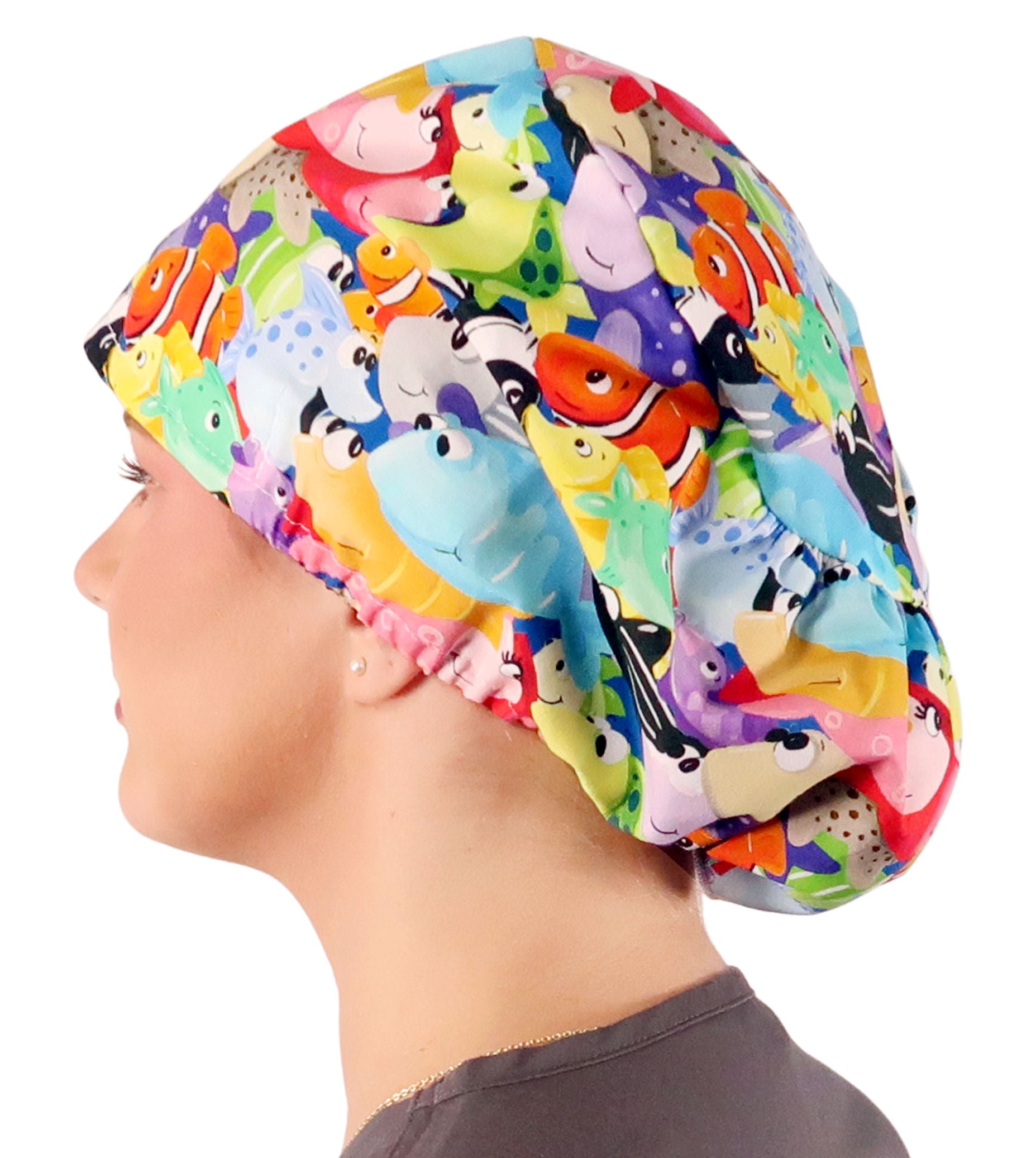 Side facing image of a woman in scrubs wearing a Under The Sea Euro Style Riley Comfort Scrub Cap.