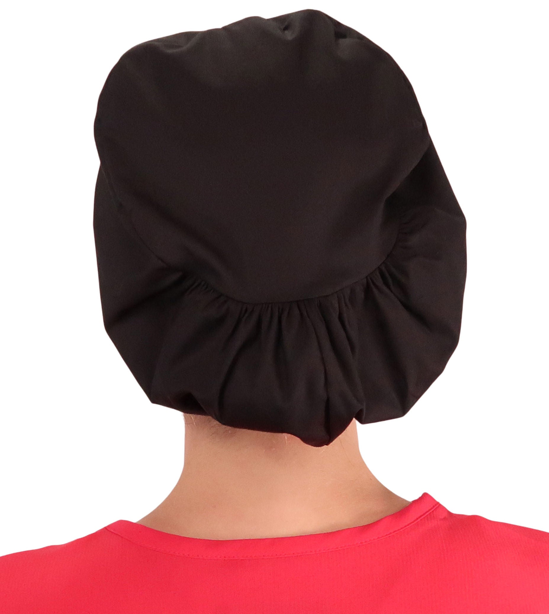 Back facing image of a woman in scrubs wearing a Pink Butterfly Patch on Black Euro Style Riley Comfort Scrub Cap.