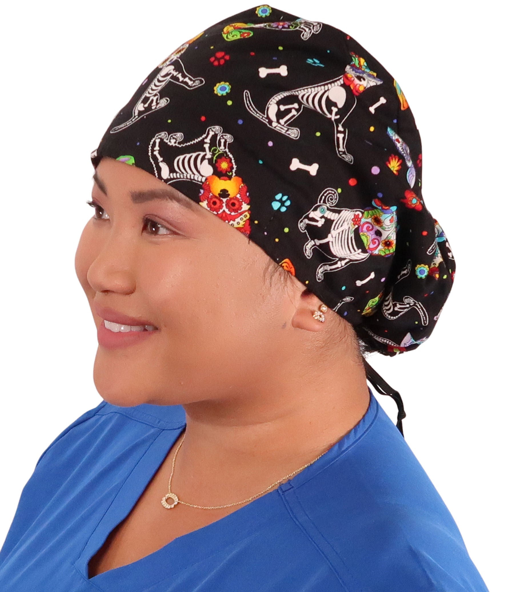 Front facing image of a woman in scrubs wearing a X - Ray Dogs Euro Style Riley Comfort Scrub Cap.