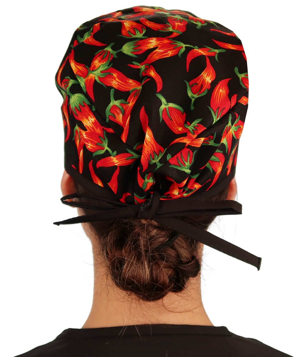 Back facing image of a woman in scrubs wearing a Classic Surgical Scrub Cap in a Mixed Chili Peppers pattern.