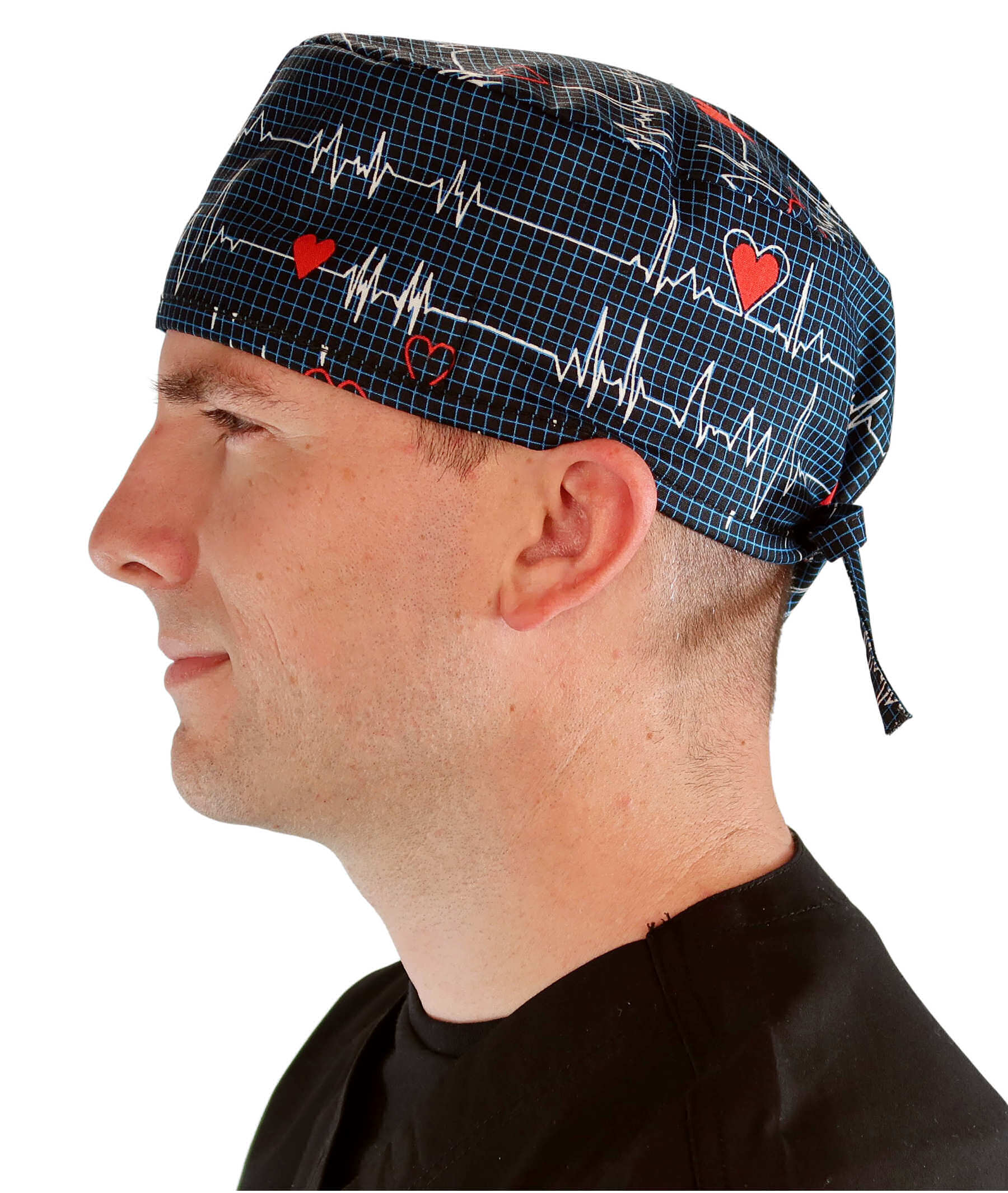 Side facing image of a man in scrubs wearing a Classic Surgical Scrub Cap in a Heartbeats on Navy pattern.