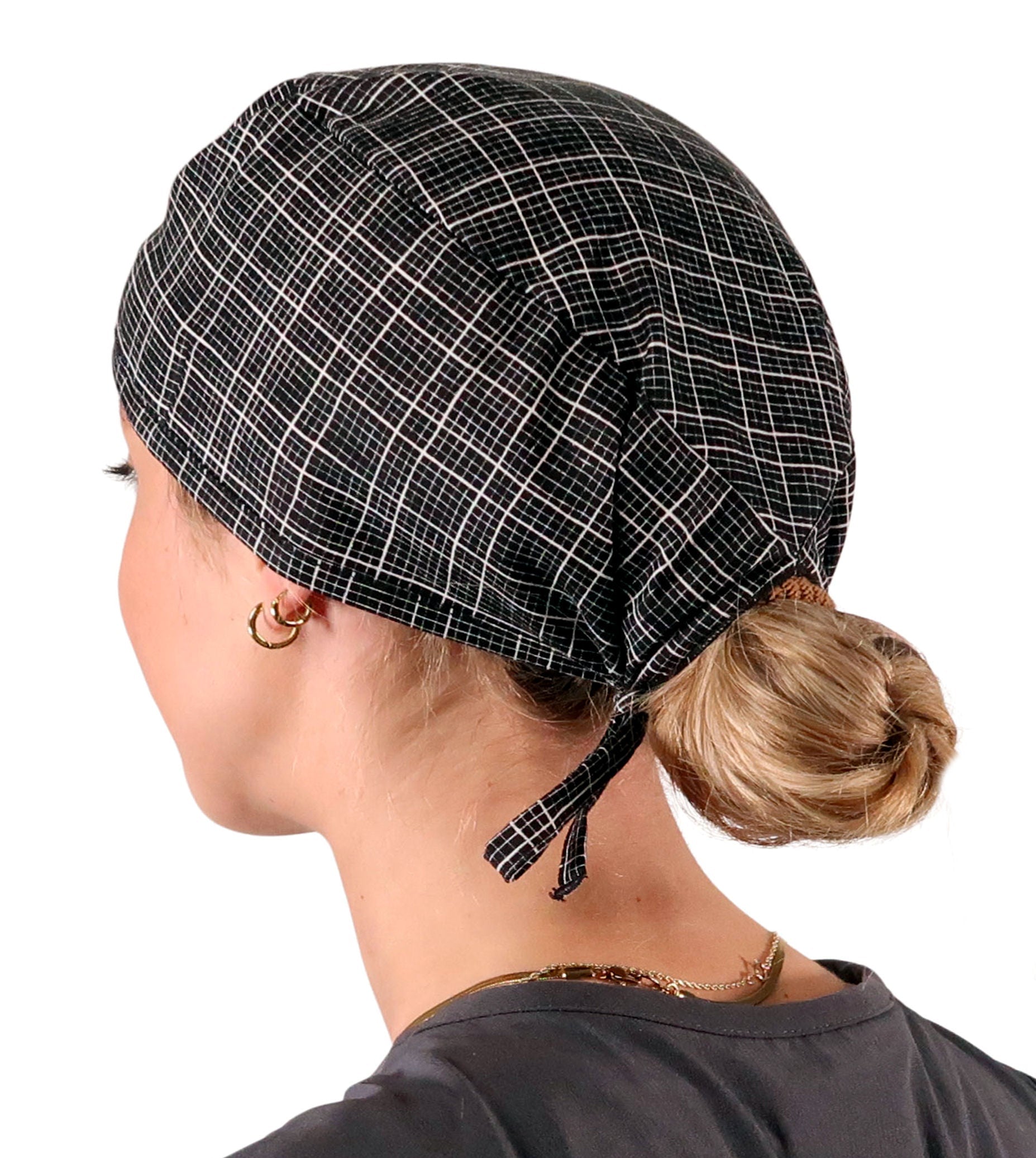 Side Facing View of a Woman Wearing a Classic Cotton Surgical Scrub Cap - Check Mate (Black and White) Pattern.