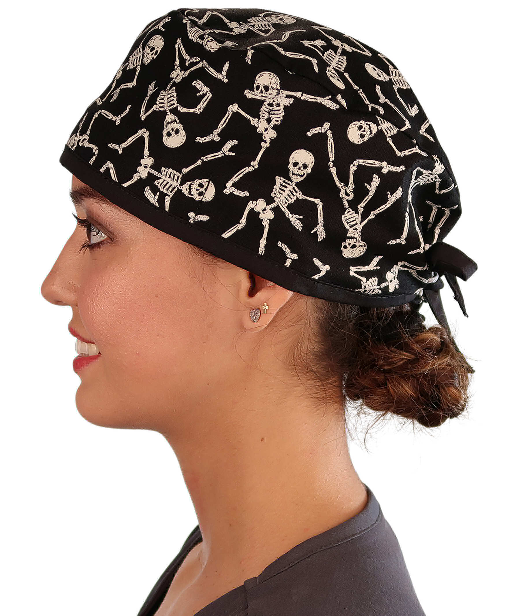 Side Facing View of a Woman Wearing a Classic Cotton Surgical Scrub Cap - Dancing Skeletons with Black Ties (Glow In The Dark) Pattern.