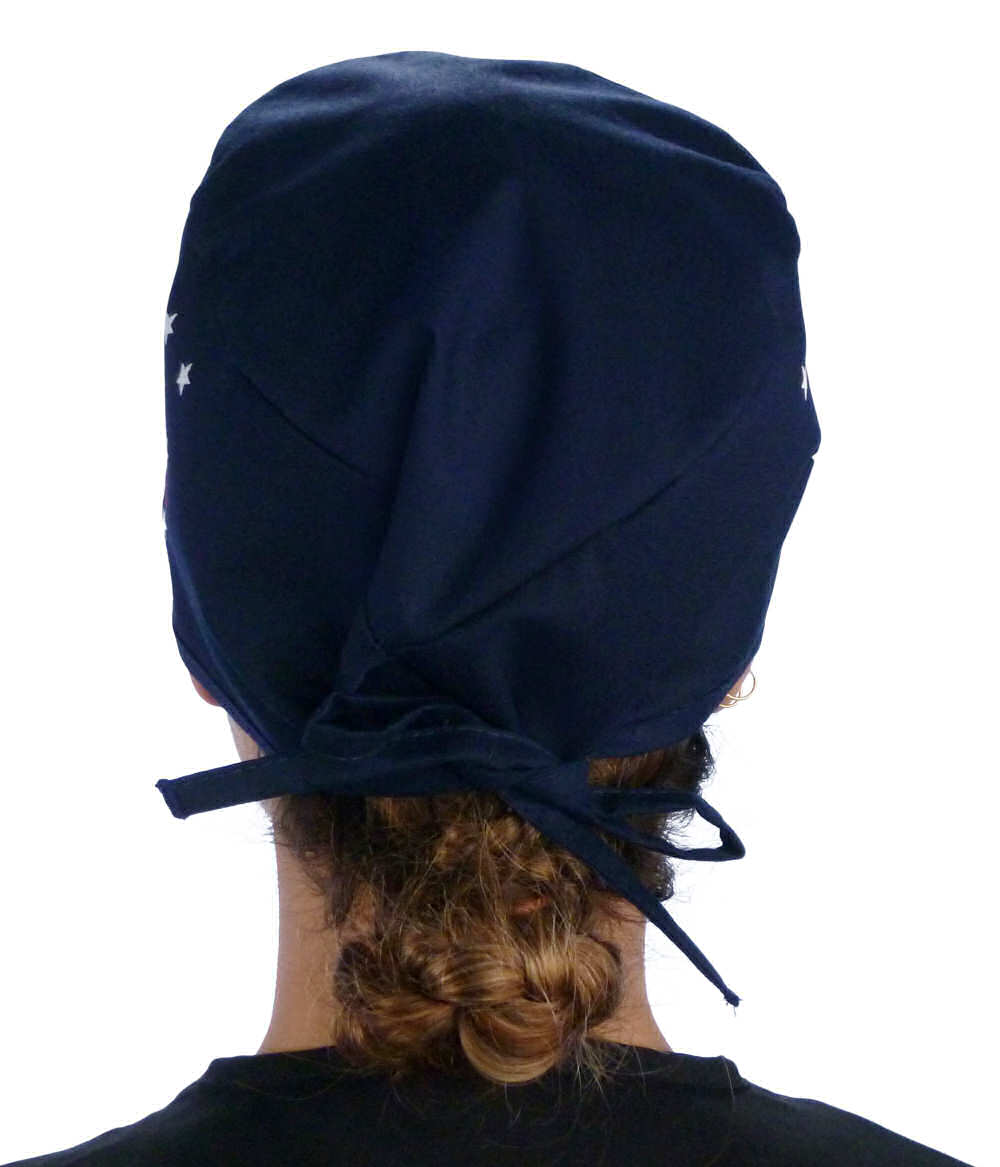 Back Facing View of a woman Wearing a Classic Cotton Surgical Scrub Cap - Patriotic Caduceus Pattern on Navy.