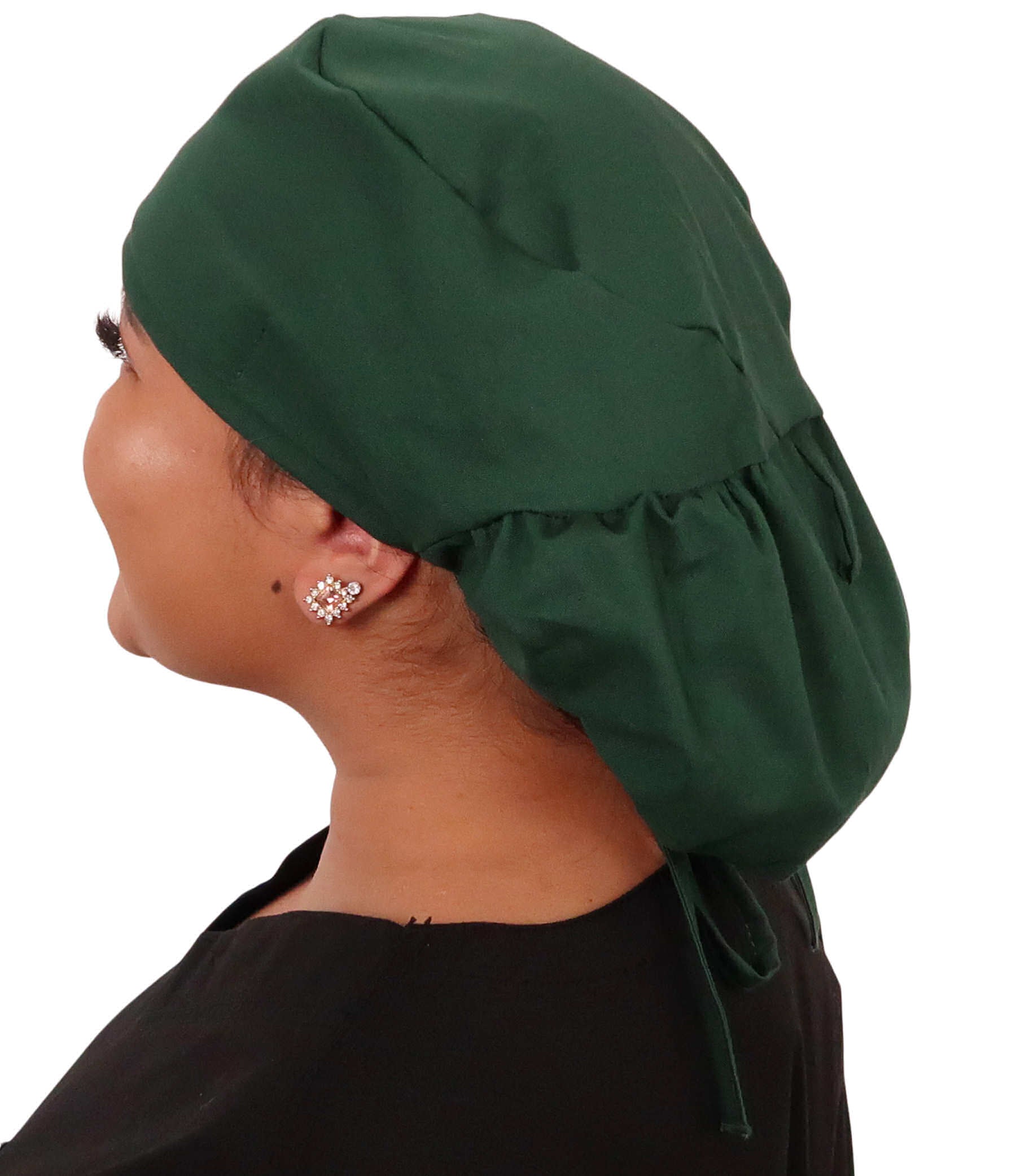 Side facing untied image of a woman in scrubs wearing a Big Hair Ponytail Scrub Cap with a Hunter Green pattern.