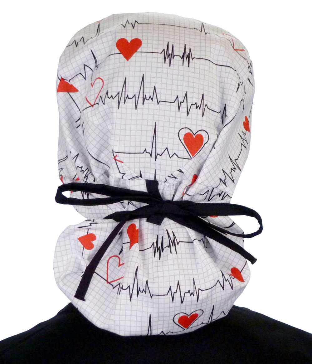 Back facing tied image of a woman in scrubs wearing a Big Hair Ponytail Scrub Cap with a Heartbeats on White pattern, and black ties to hold the scrub cap in place.