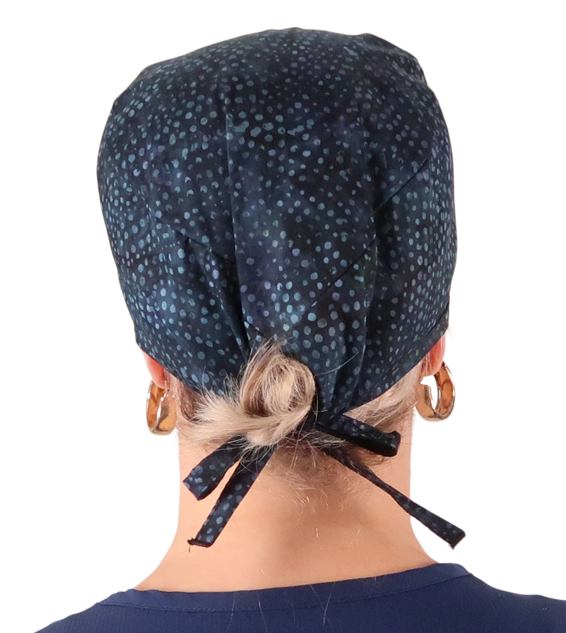 Back Facing View of a Woman Wearing a Classic Cotton Surgical Scrub Cap - Midnight Navy Batik Pattern.