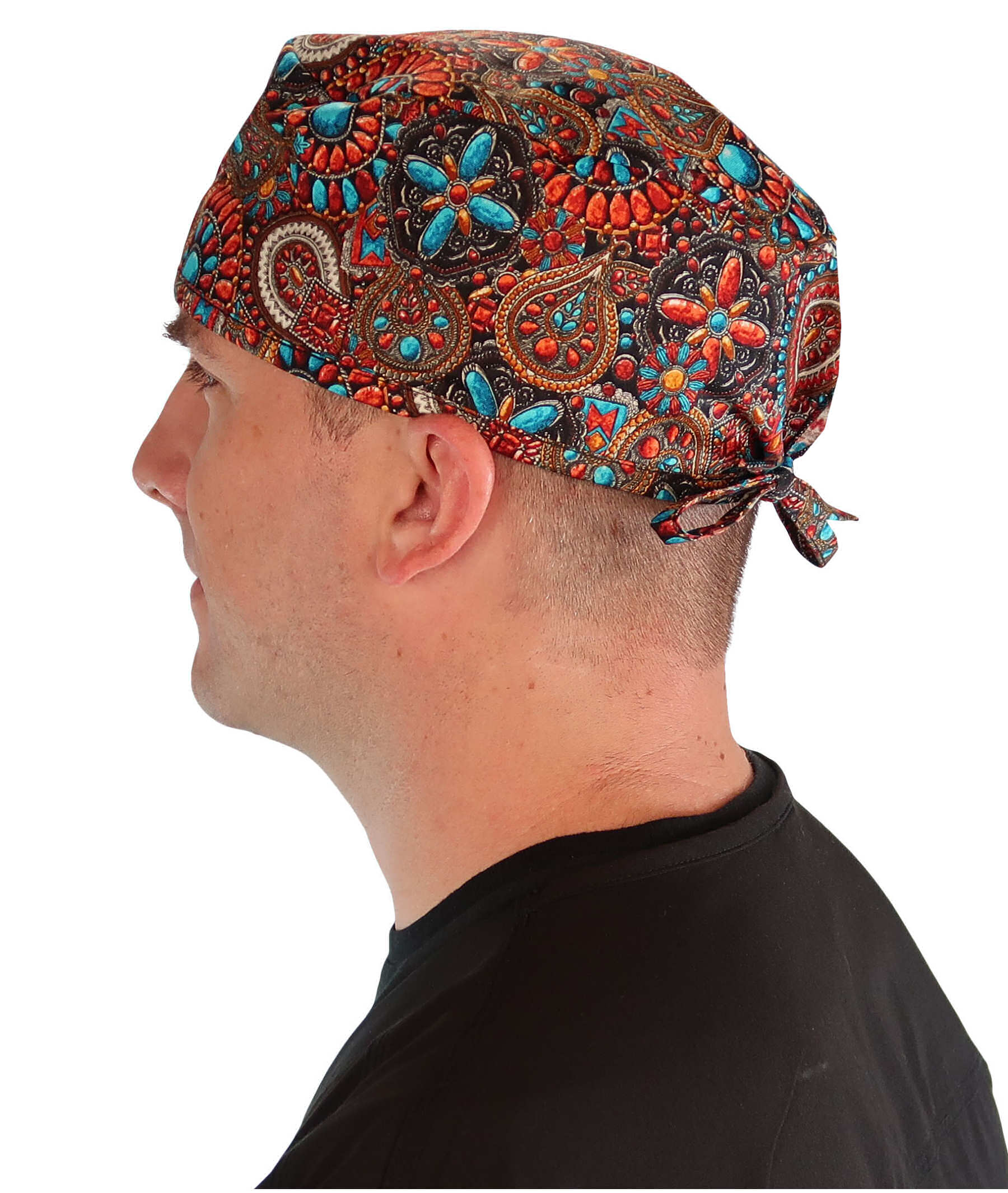 Side facing image of a man in scrubs wearing a Classic Surgical Scrub Cap in Indian Jewelry Coral pattern.