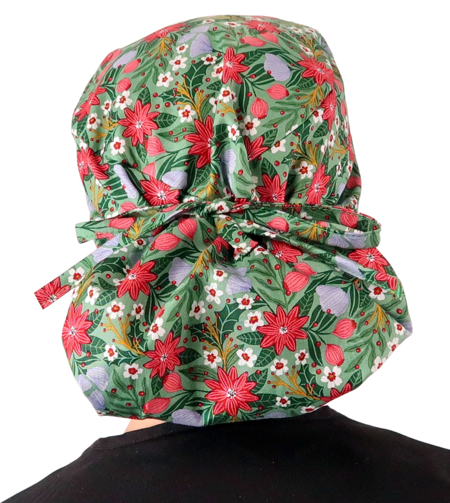 Back facing tied image of a woman in scrubs wearing a Big Hair Ponytail Scrub Cap with a Poinsettia Party pattern. 