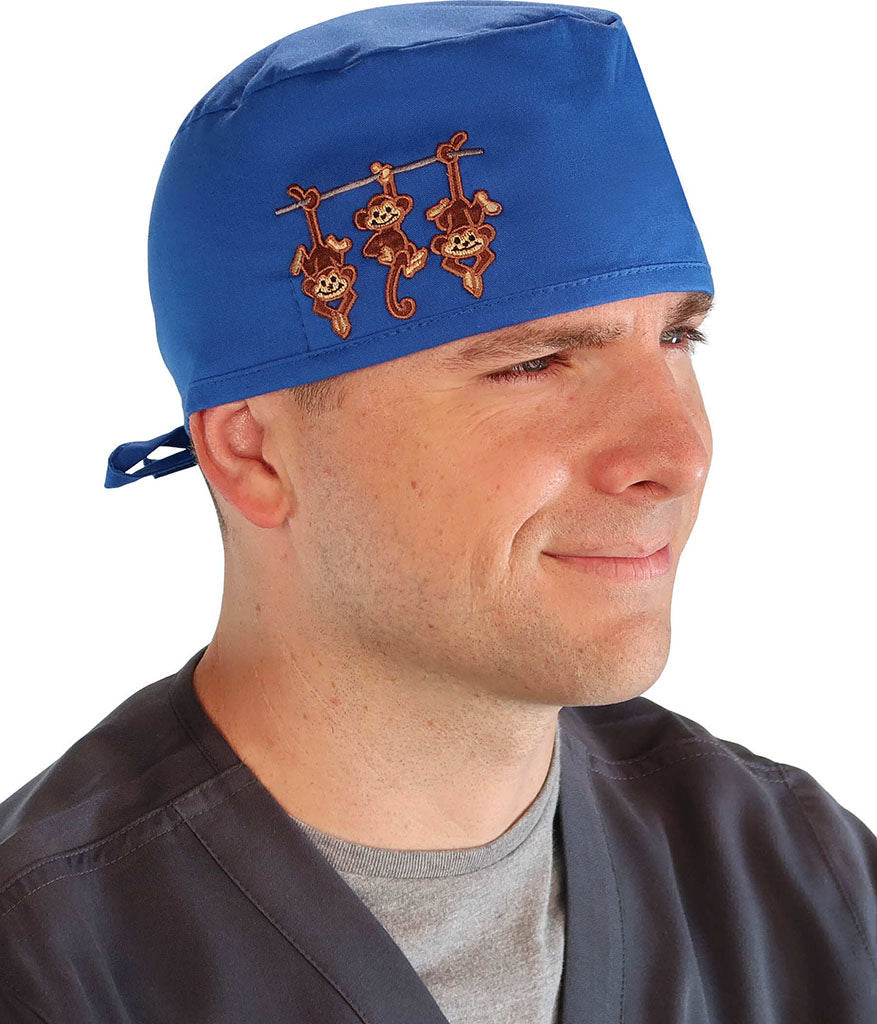 Side Facing View of a Man Wearing a Classic Cotton Surgical Scrub Cap - Royal Fabric with Three Monkeys Patch.