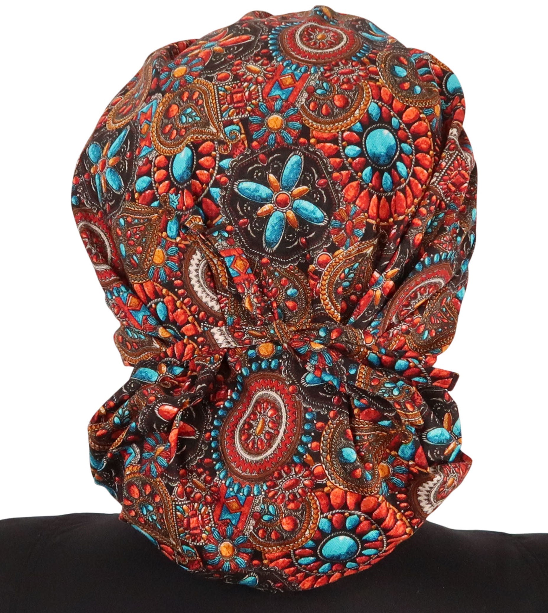 Back Facing Tied View of a Woman Wearing a Tied Back Banded Bouffant Ponytail Surgical Scrub Cap - Indian Jewelry Coral Patterned Fabric