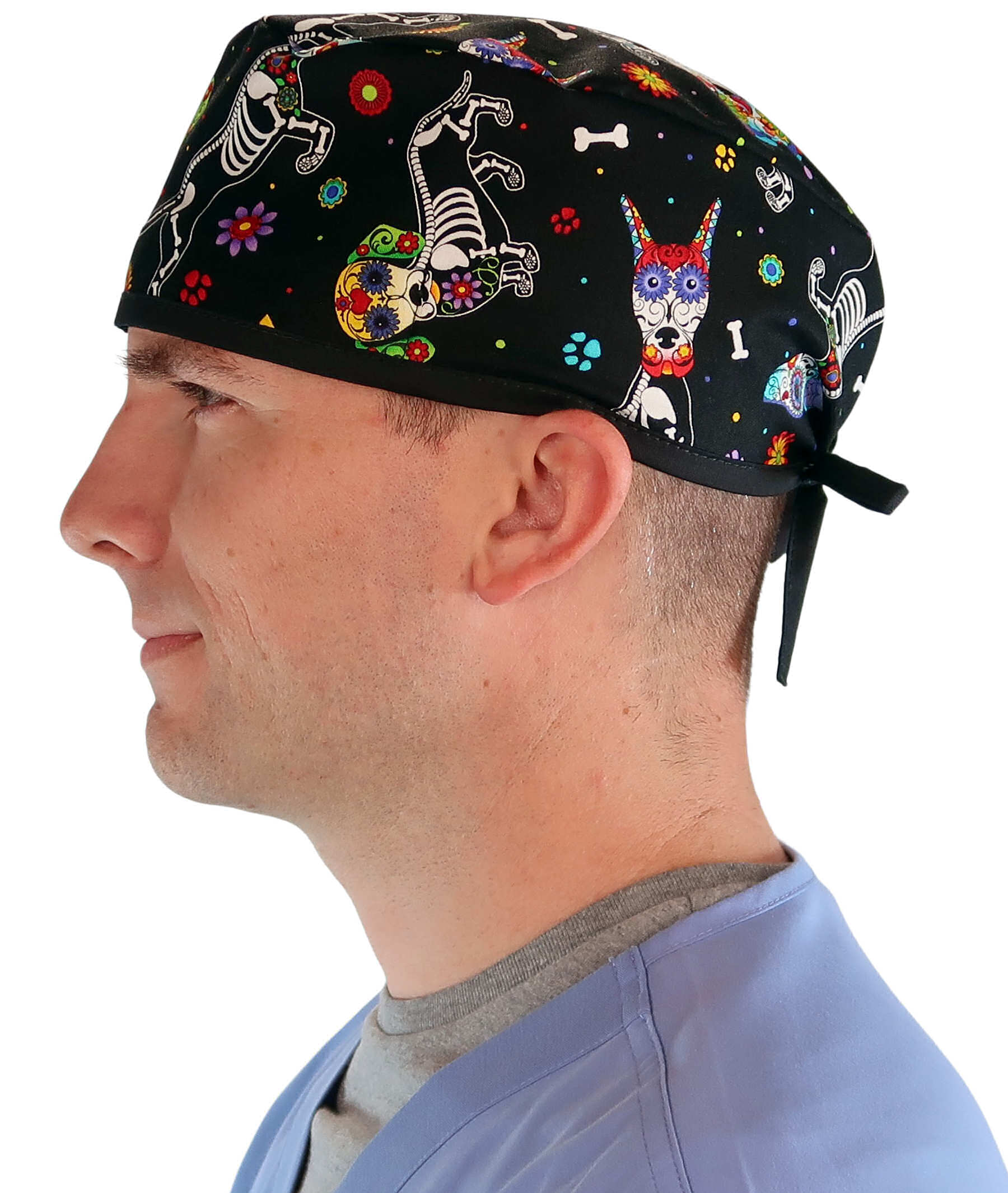 Side facing image of a man in scrubs wearing a Classic Surgical Scrub Cap in a X Ray Dogs with black ties pattern.