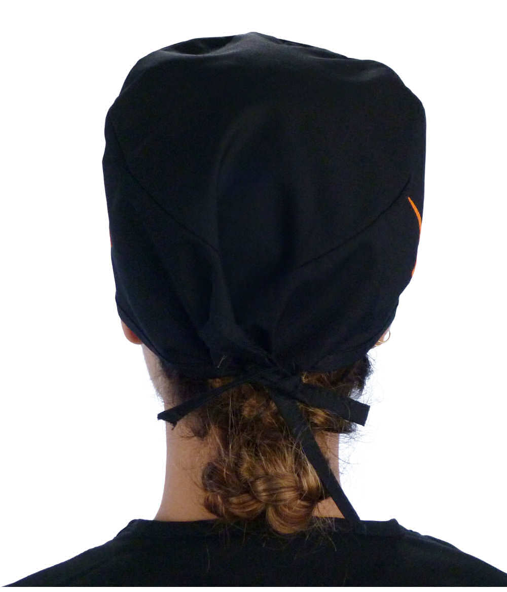 Back facing image of a woman in scrubs wearing a Classic Surgical Scrub Cap in a EKG Signal and Medical Sign pattern.
