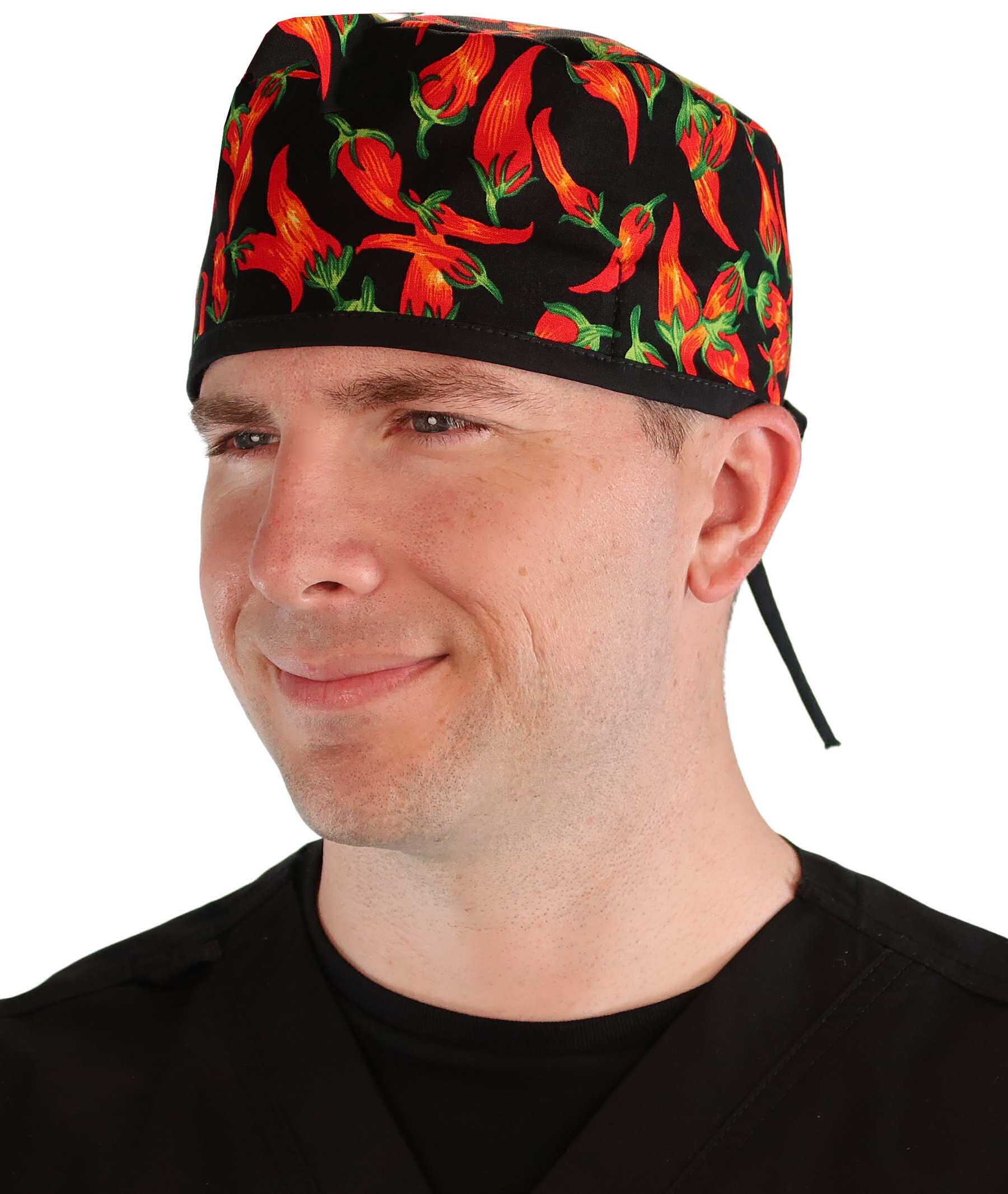 Front facing image of a man in scrubs wearing a Classic Surgical Scrub Cap in a Mixed Chili Peppers pattern.