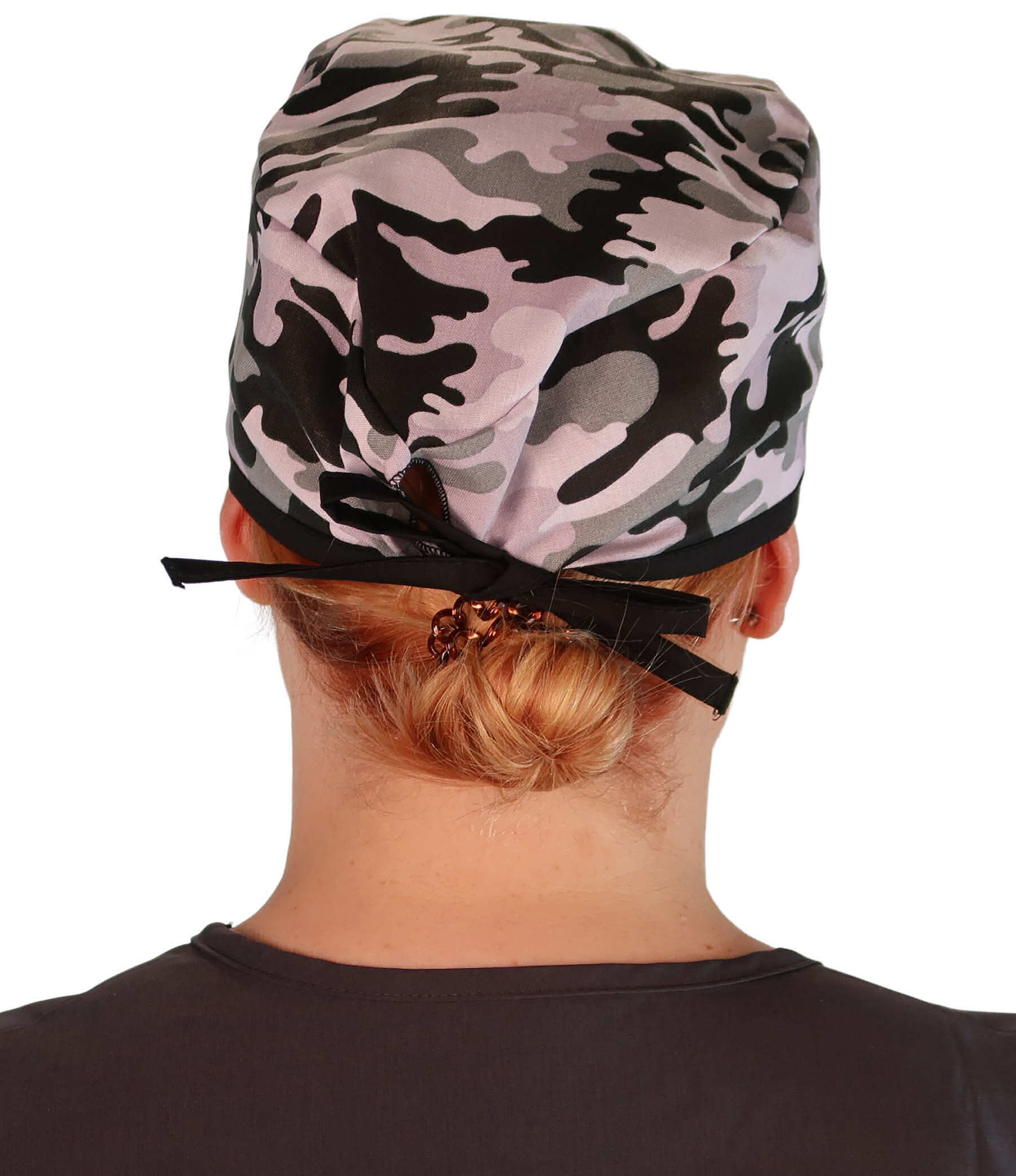 Back Facing View of a Woman Wearing a Classic Cotton Surgical Scrub Cap - Kickin Camo Black and Grey with Black Ties Pattern.