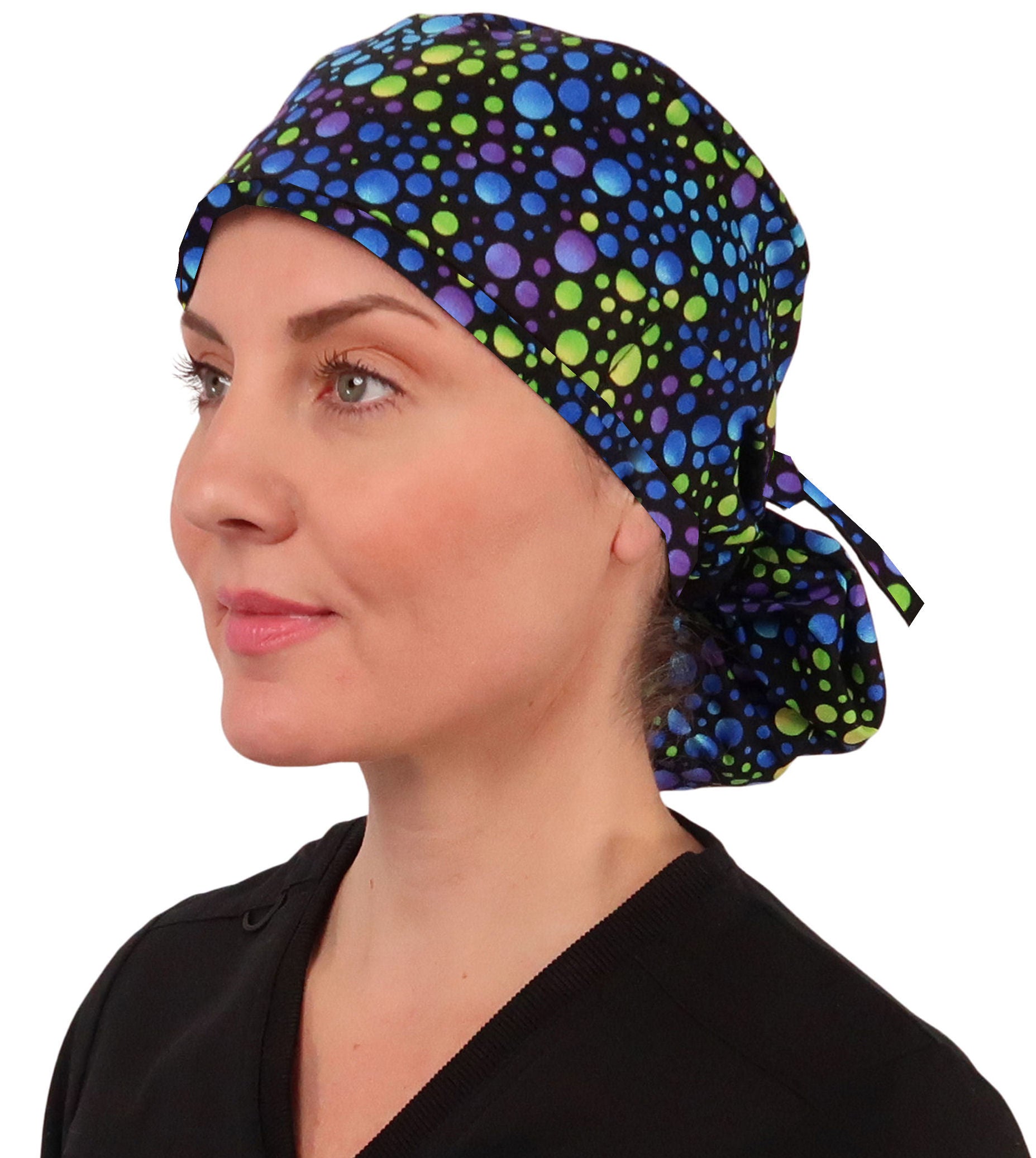 Side facing tied image of a woman in scrubs wearing a Blue, Green and Purple Big Hair Ponytail Scrub Cap.