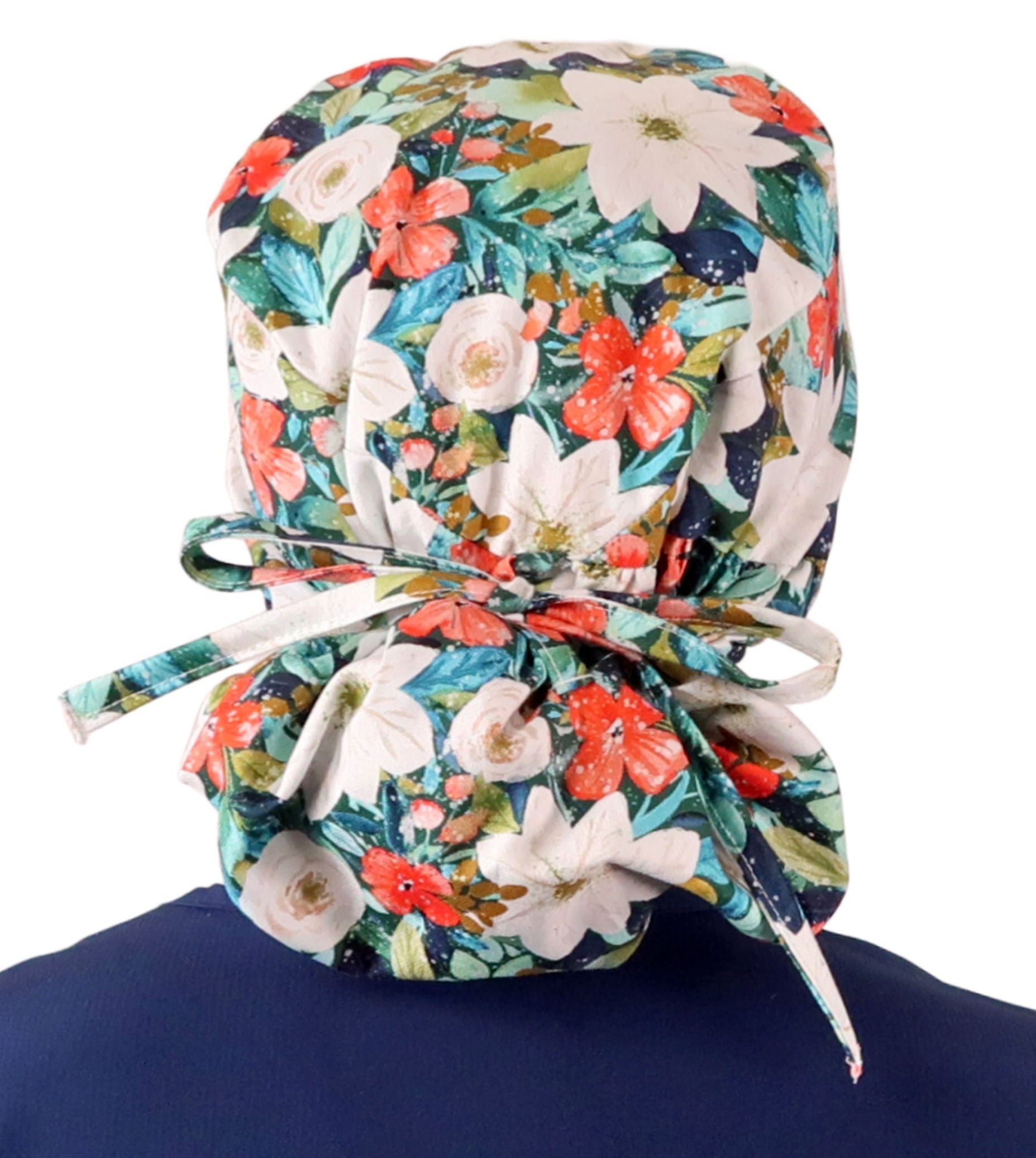 Back facing tied image of a woman in scrubs wearing a Big Hair Ponytail Scrub Cap with a Lush Winter Foliage pattern.