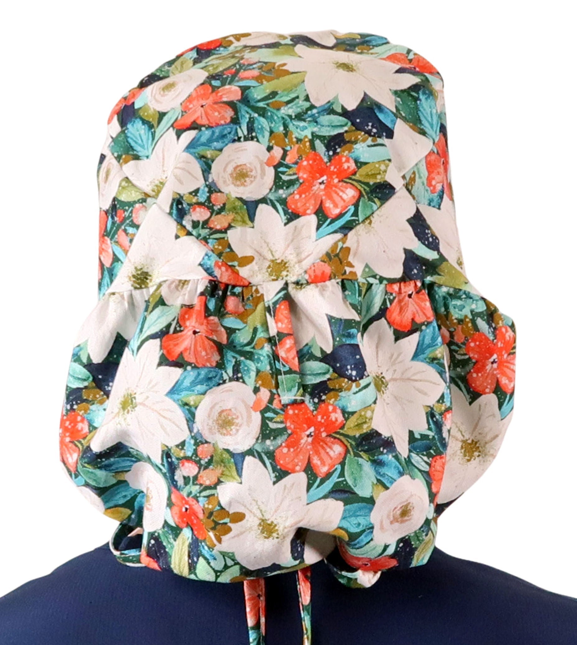Back facing untied image of a woman in scrubs wearing a Big Hair Ponytail Scrub Cap with a Lush Winter Foliage pattern.