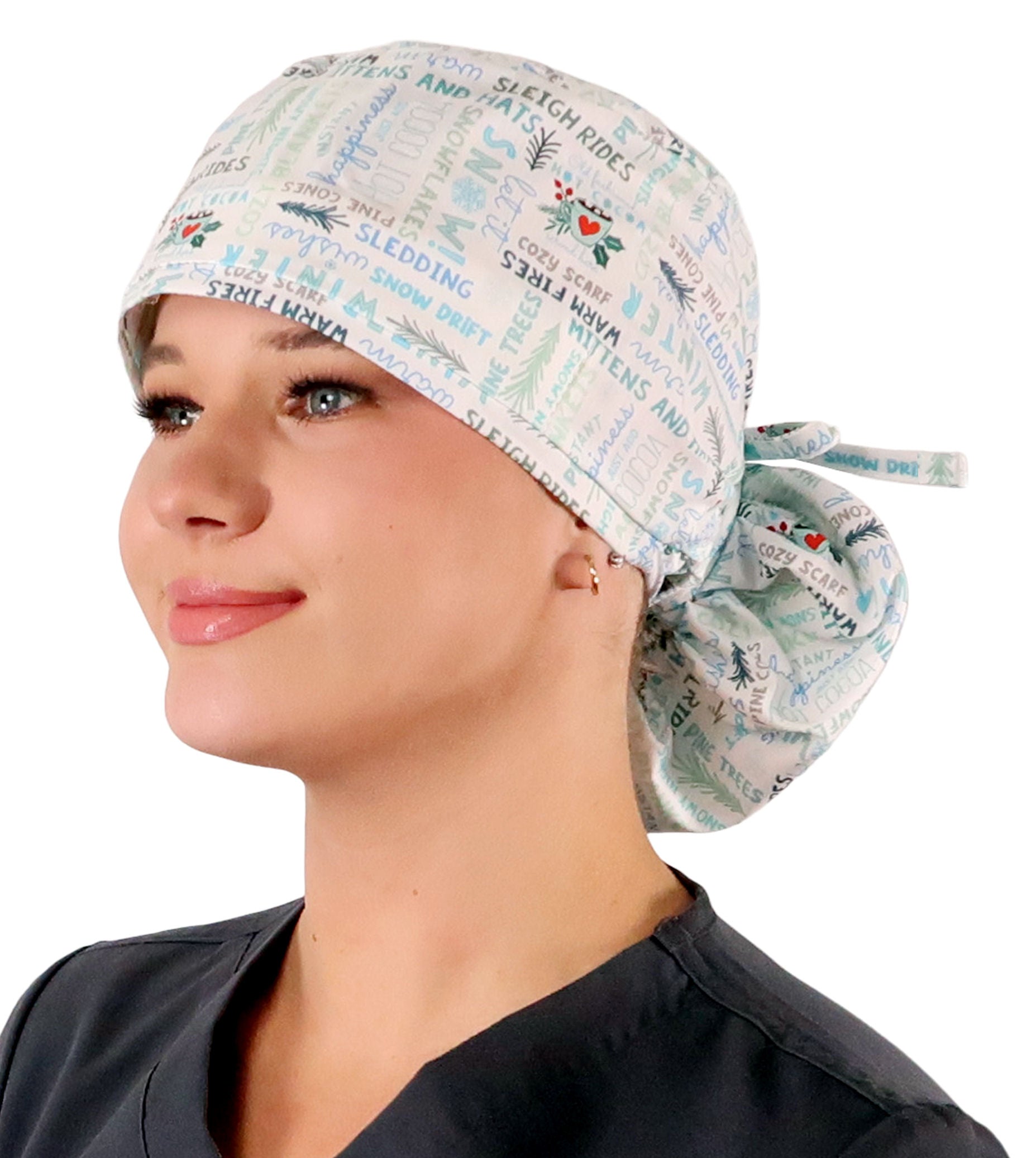 Front facing tied image of a woman in scrubs wearing a Big Hair Ponytail Scrub Cap with a Wonderful Winter Words pattern.