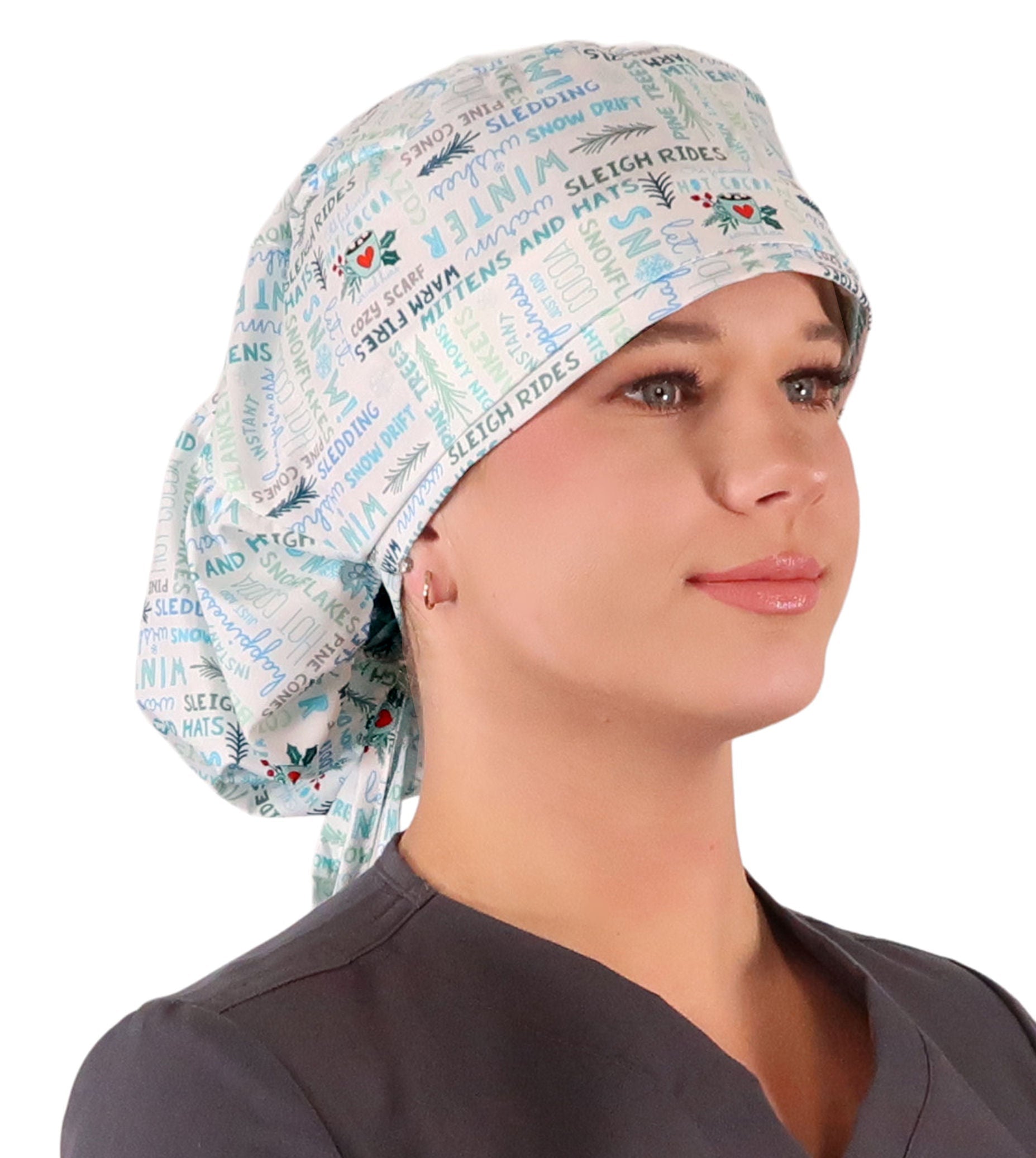 Front facing untied image of a woman in scrubs wearing a Big Hair Ponytail Scrub Cap with a Wonderful Winter Words pattern.