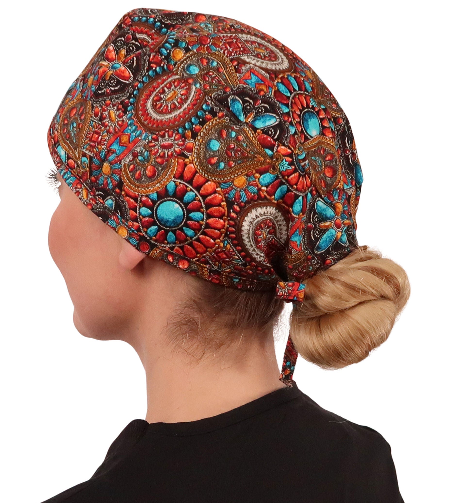 Side facing image of a woman in scrubs wearing a Classic Surgical Scrub Cap in Indian Jewelry Coral pattern.