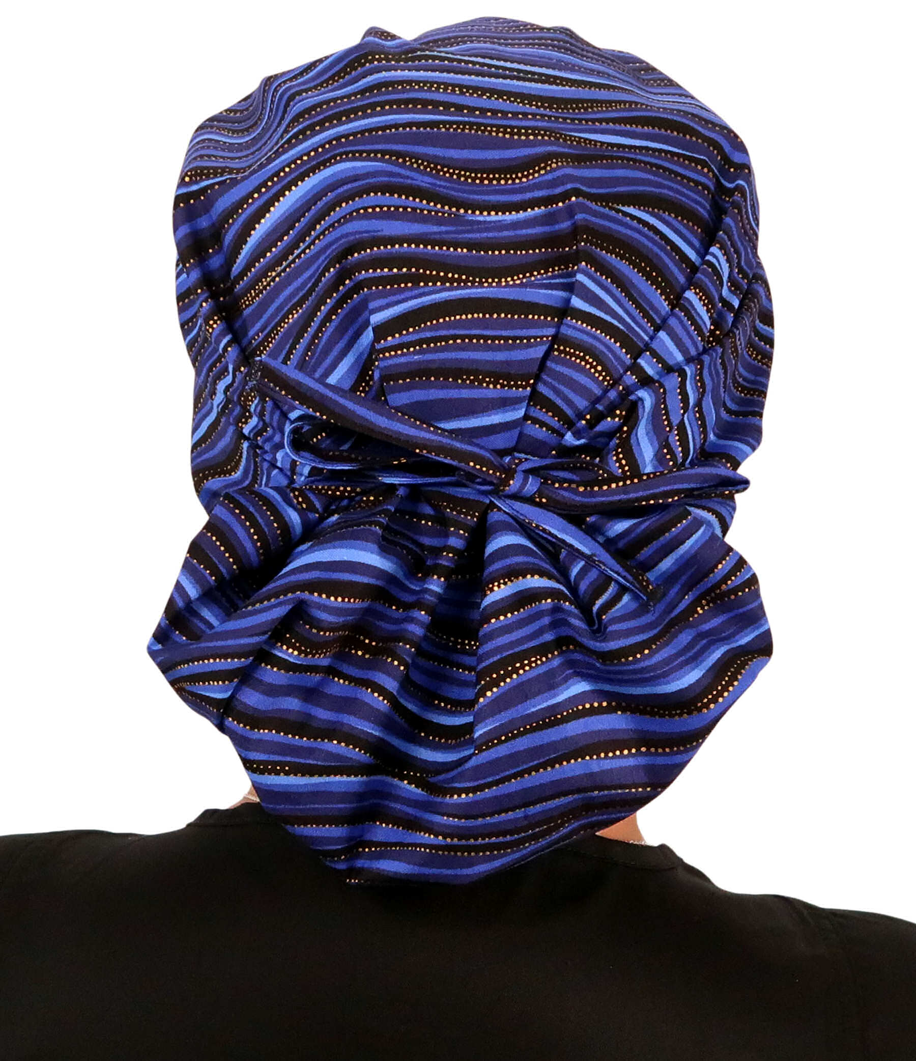 Back Facing Tied View of a Woman Wearing a Banded Bouffant Ponytail Surgical Scrub Cap - Waves of Blue Patterned Fabric 