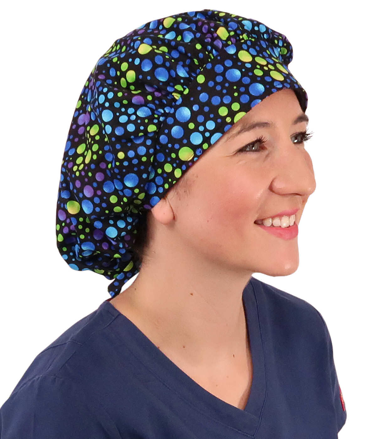 Front Facing Untied View of a Woman Wearing a Tied Back Banded Bouffant Ponytail Surgical Scrub Cap - Blue, Green and Purple Dots Patterned Fabric  