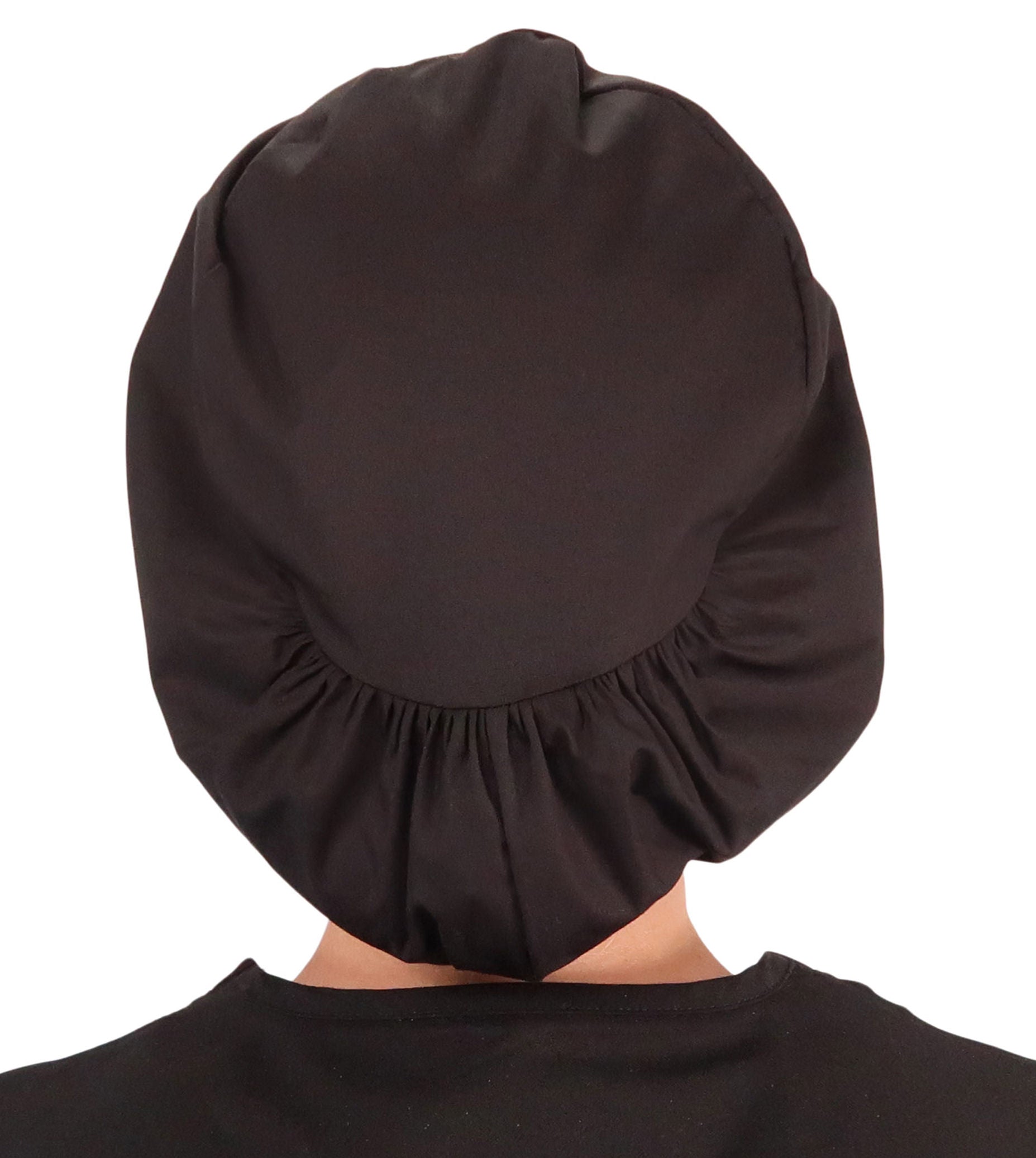 Back facing image of a woman in scrubs wearing a Three Monkeys Patch on Black Euro Style Riley Comfort Scrub Cap.