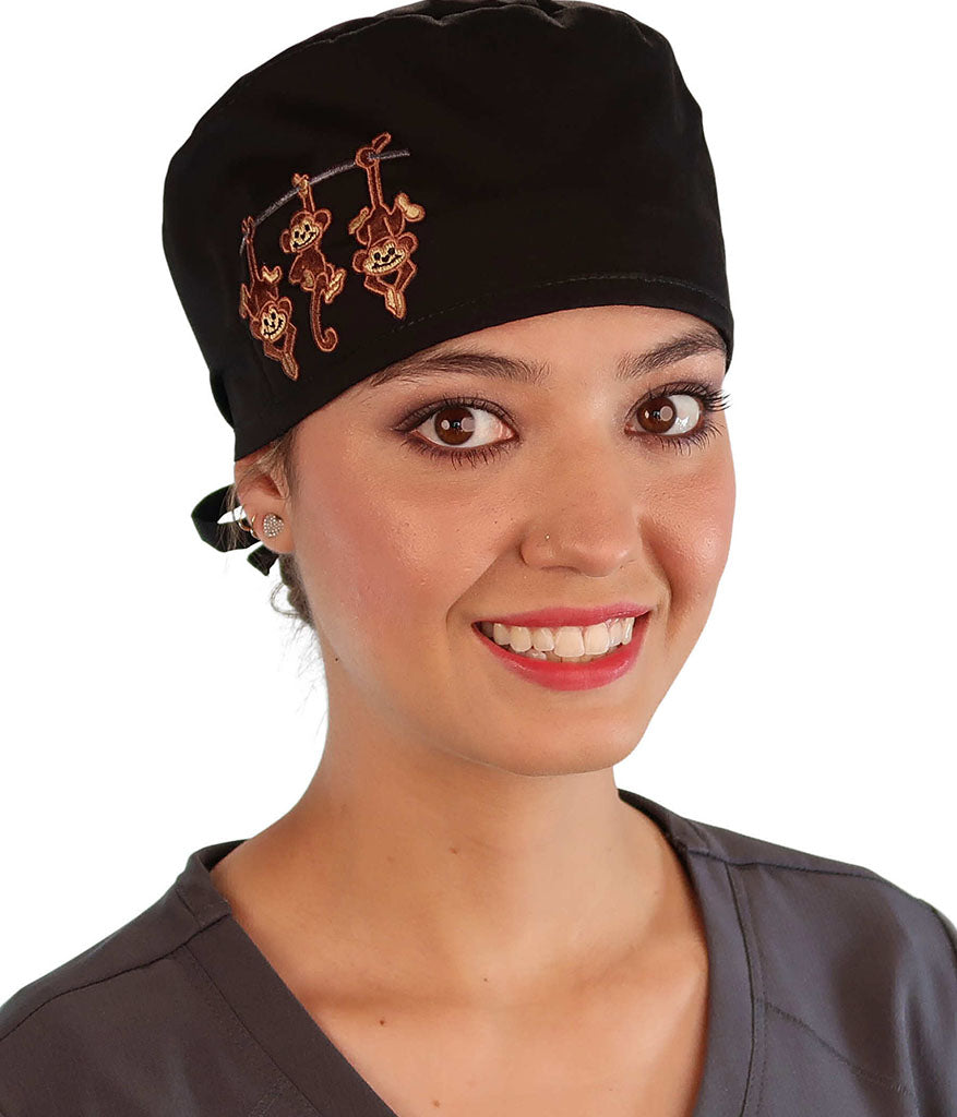 Front Facing View of a Woman Wearing a Classic Cotton Surgical Scrub Cap - Black with Three Monkeys Patch.
