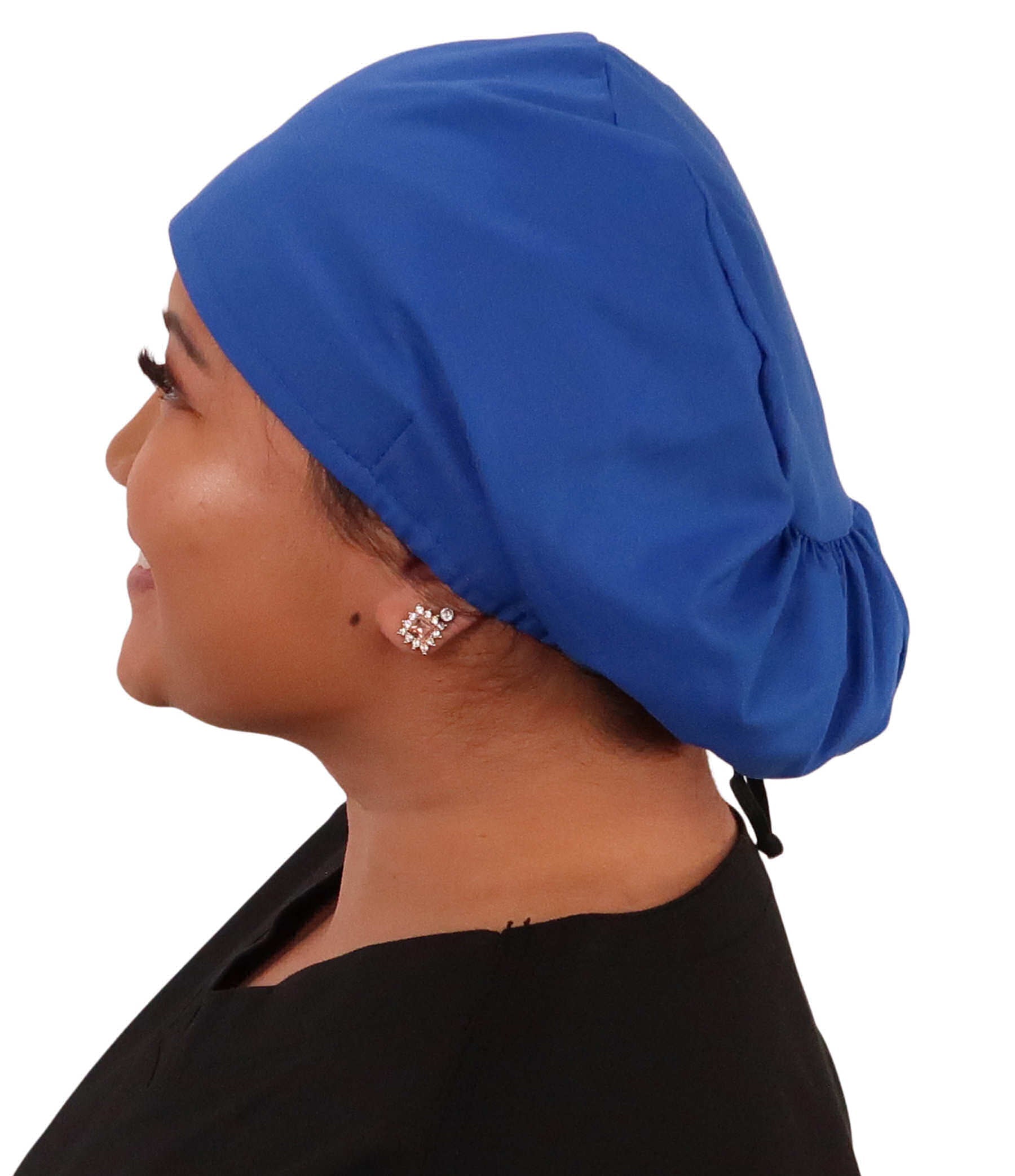 Side facing image of a woman in scrubs wearing a Royal Euro Style Riley Comfort Scrub Cap.